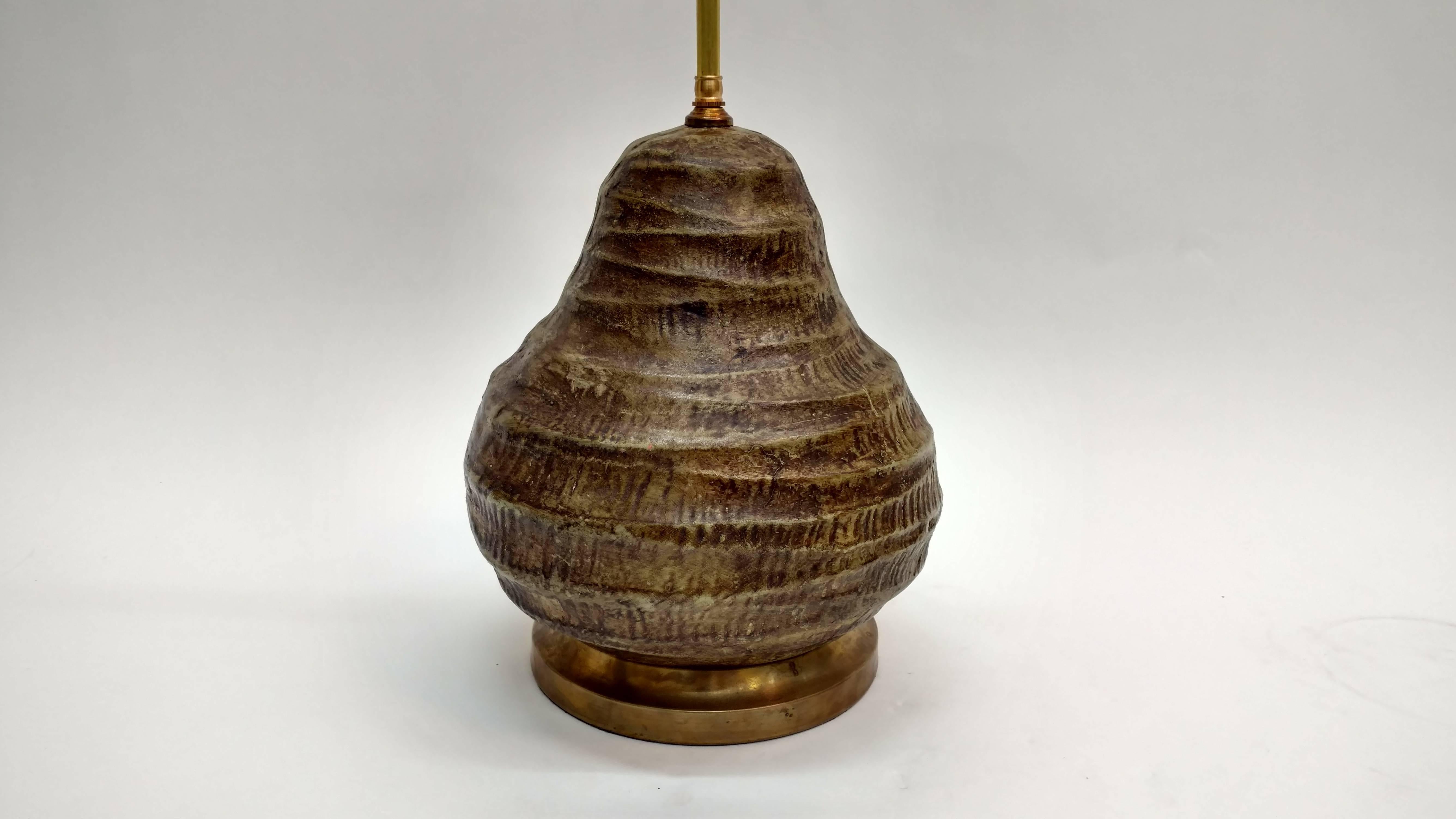 Pottery lamp resembling a pear.
Rewired with double pull chain sockets and brass base.