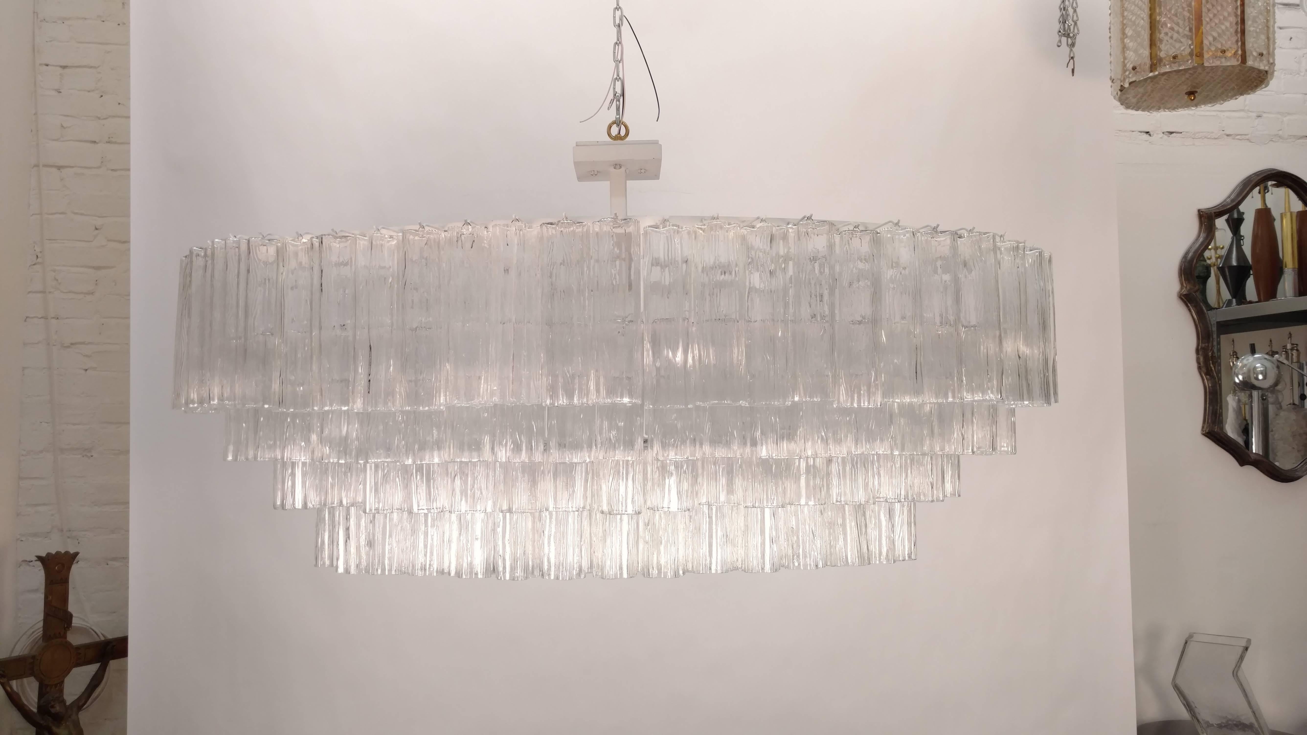 Large Venini glass chandelier composed of approximately 200 tronchi glass.
Rewired with 26 new candelabra sockets.
Max. 40 watt per socket.