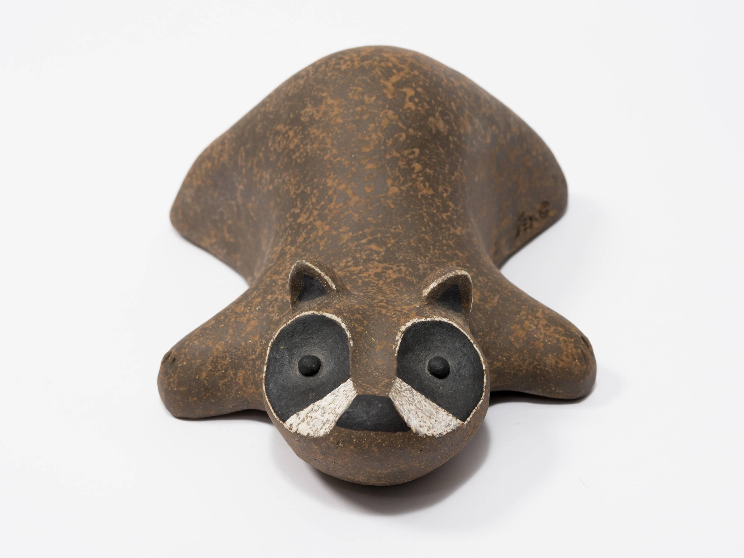 A 1970s stoneware raccoon sculpture by John H. Seymour.