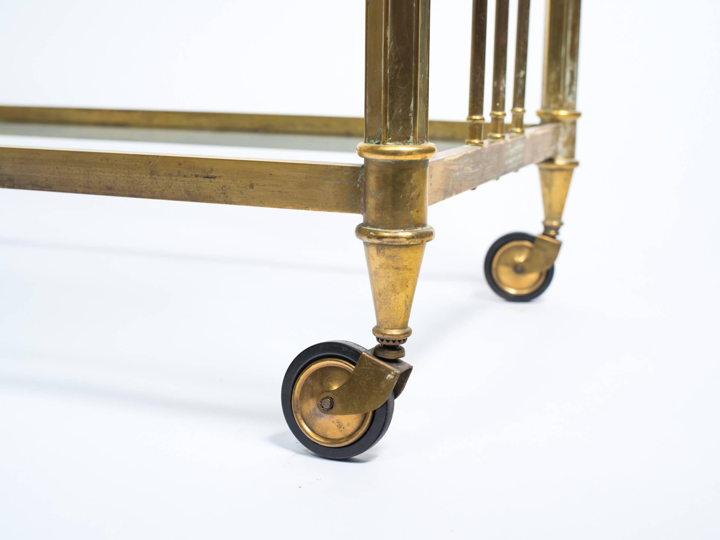 Elegant brass two-tier bar cart.