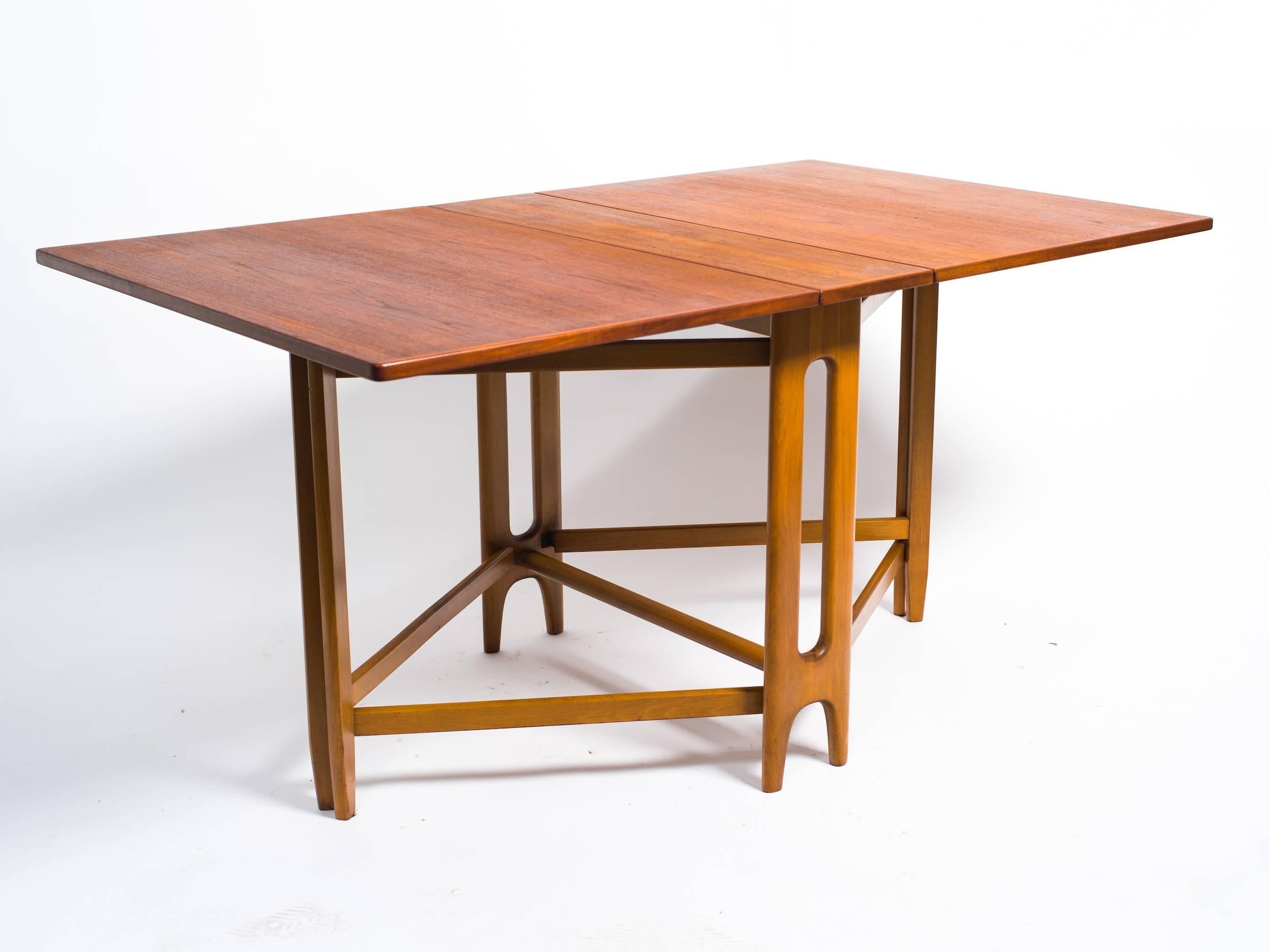 1970s teak Danish extension table

Dimensions listed are with table closed. When fully extended. Measures: Depth is 58 inches.