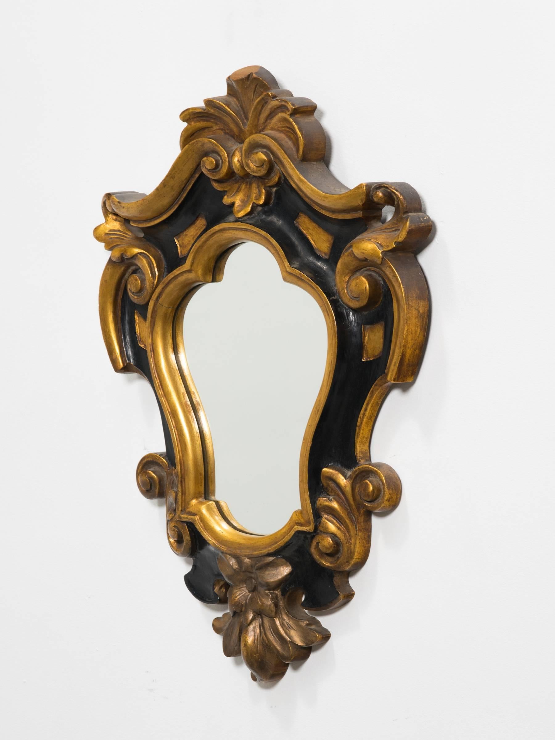 1930s carved wood decorative Rococo style  mirror.
Great metal label on the back.