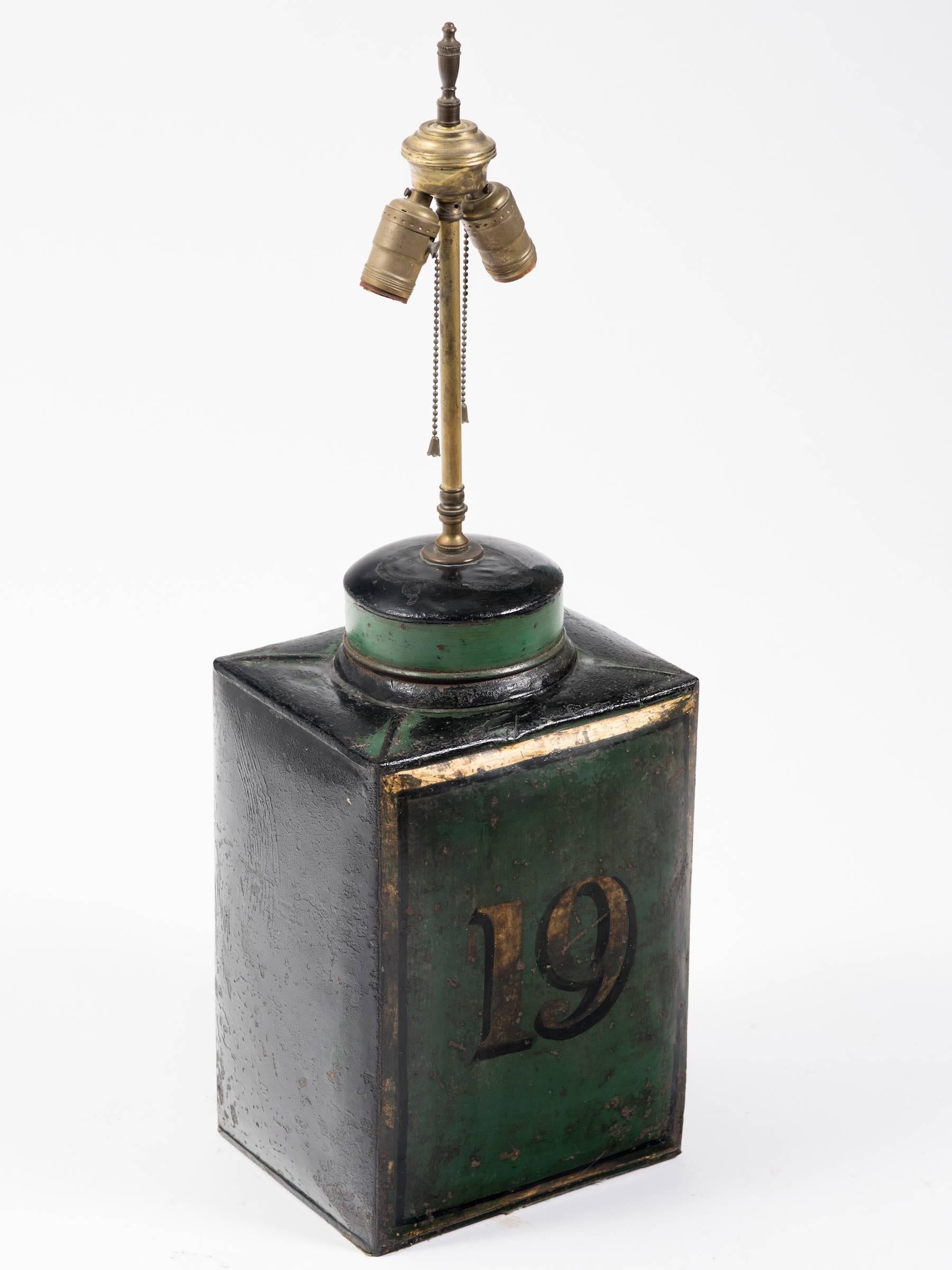 19th century tole tea canister turned into a table lamp.

 