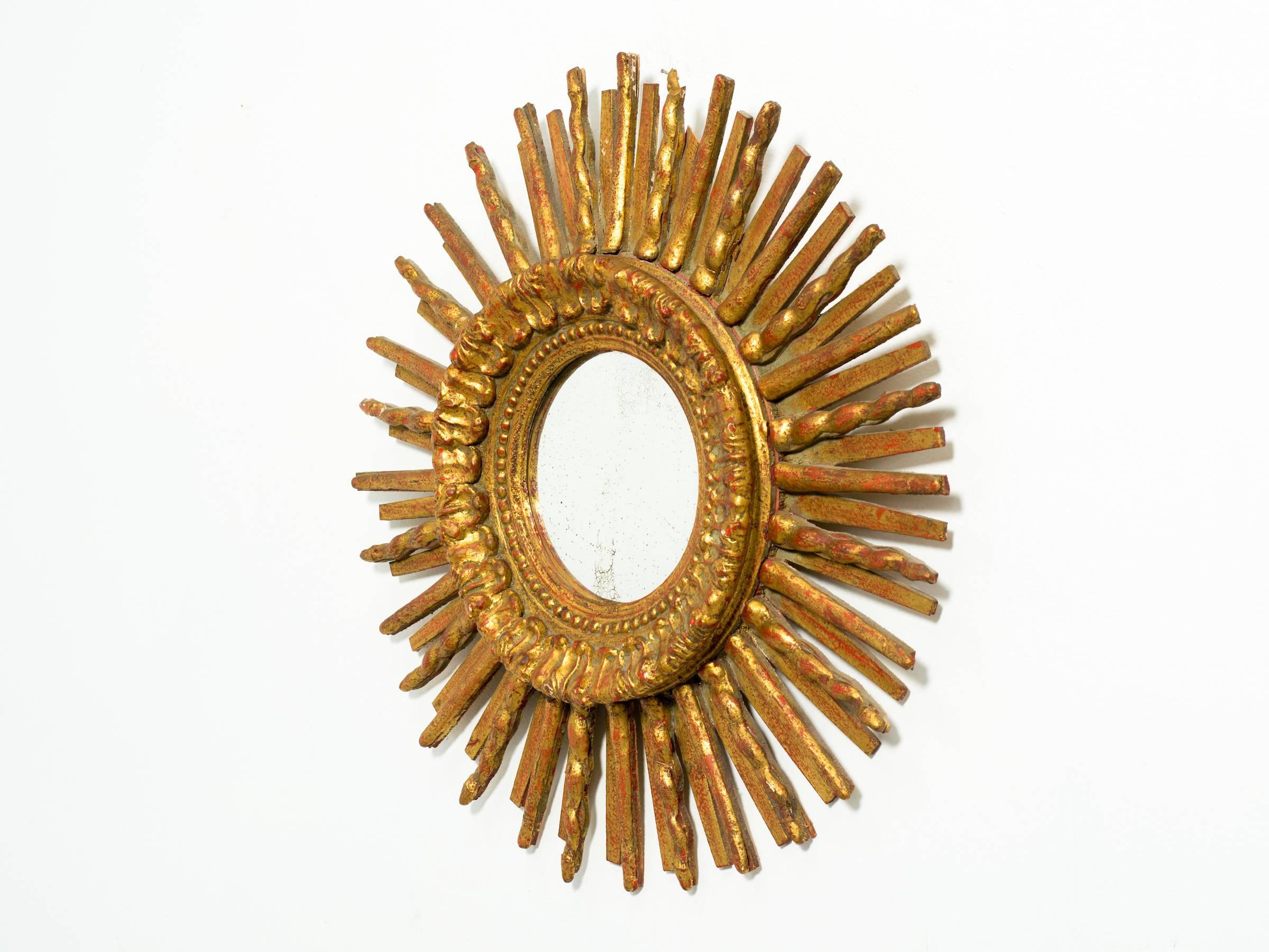 1960s giltwood sunburst mirror from Italy.