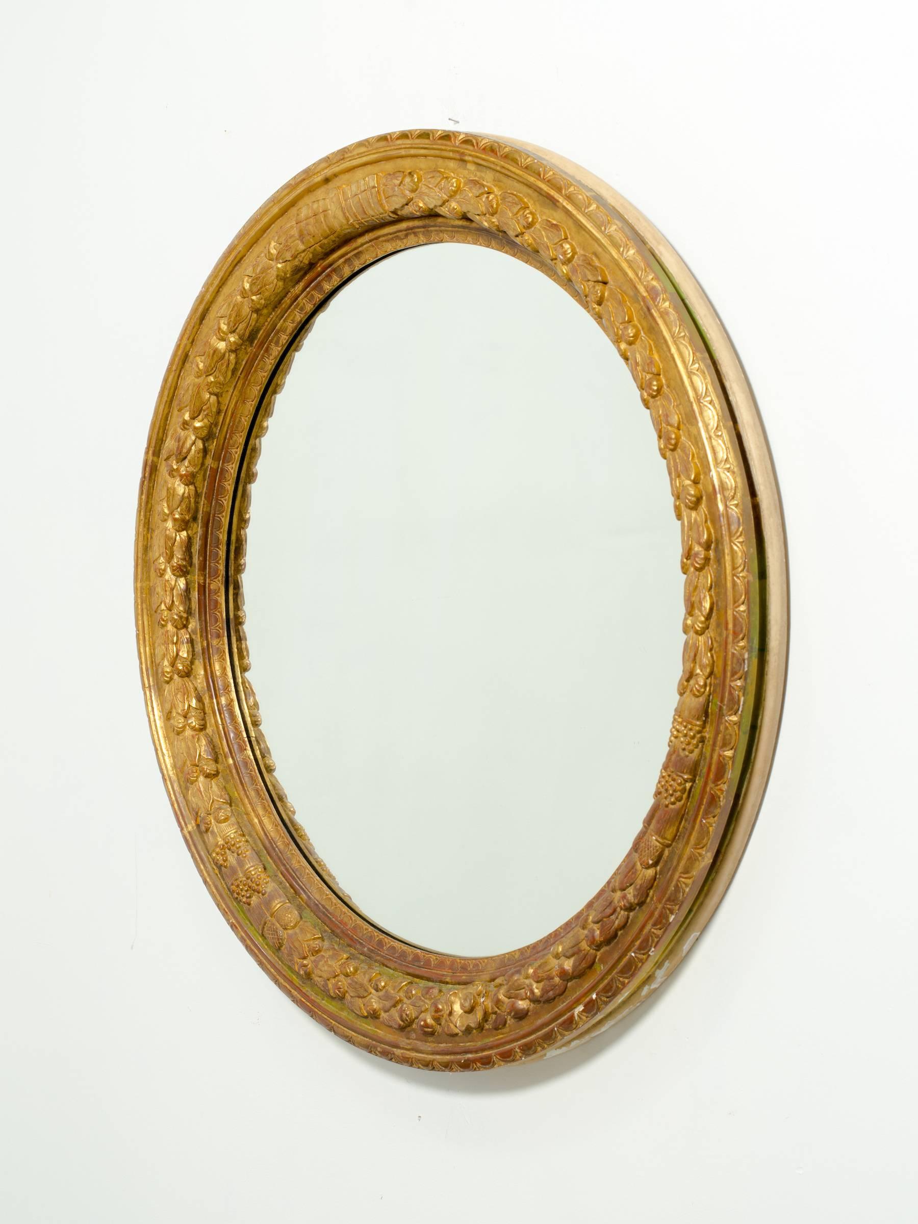 Great carved giltwood round mirror.