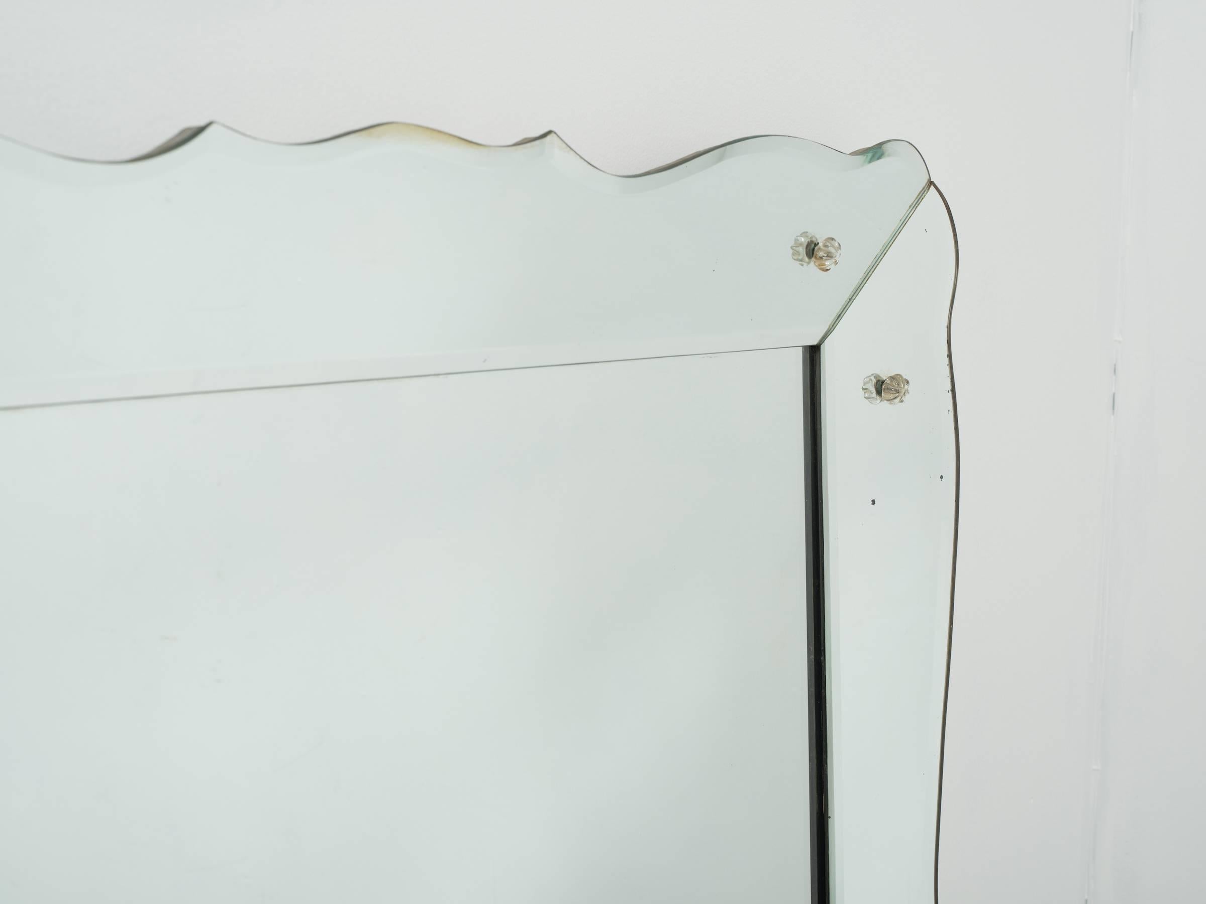 Large 1950s Venetian style beveled mirror.