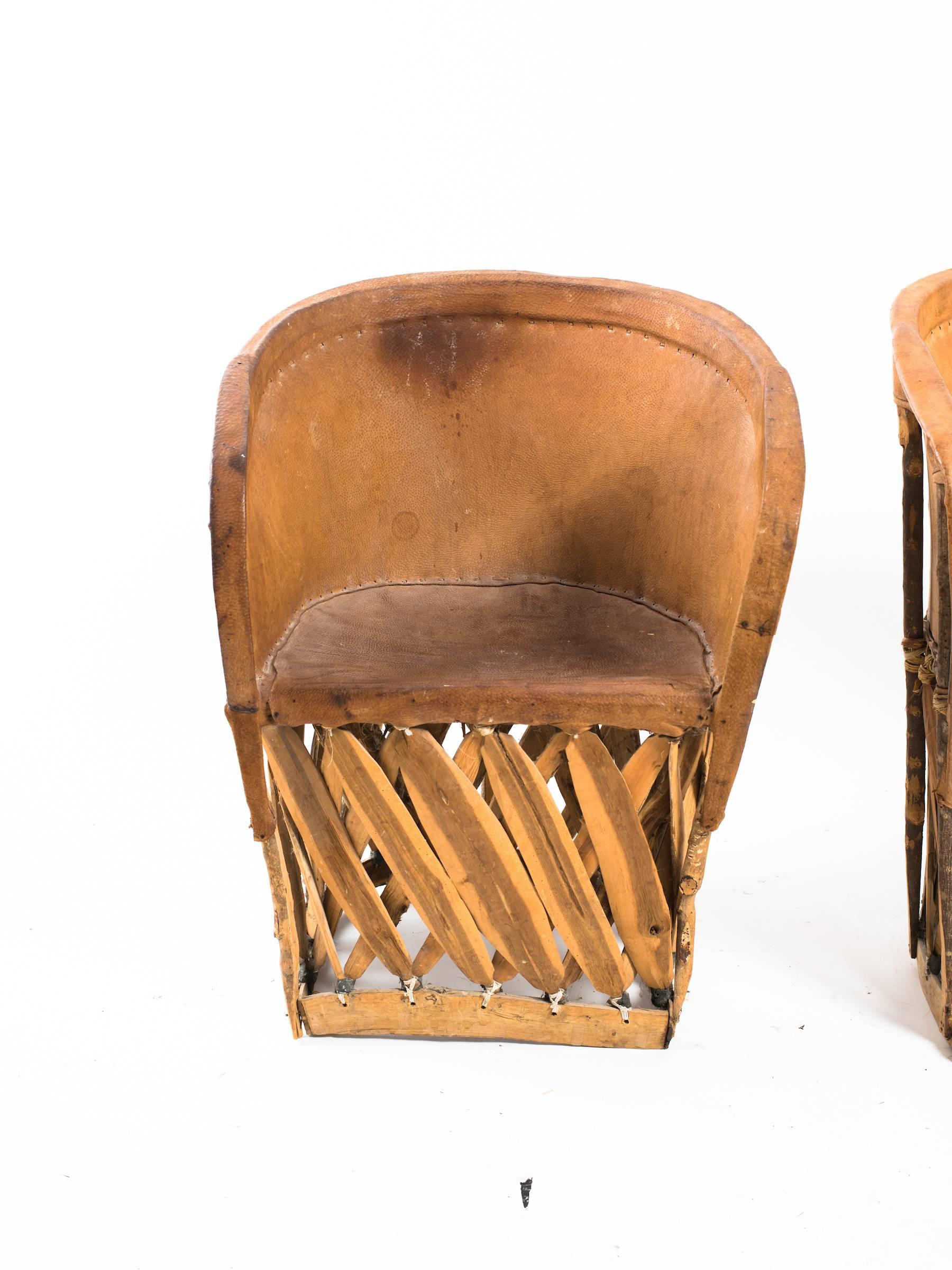 Four leather safari chairs from the 1970s.