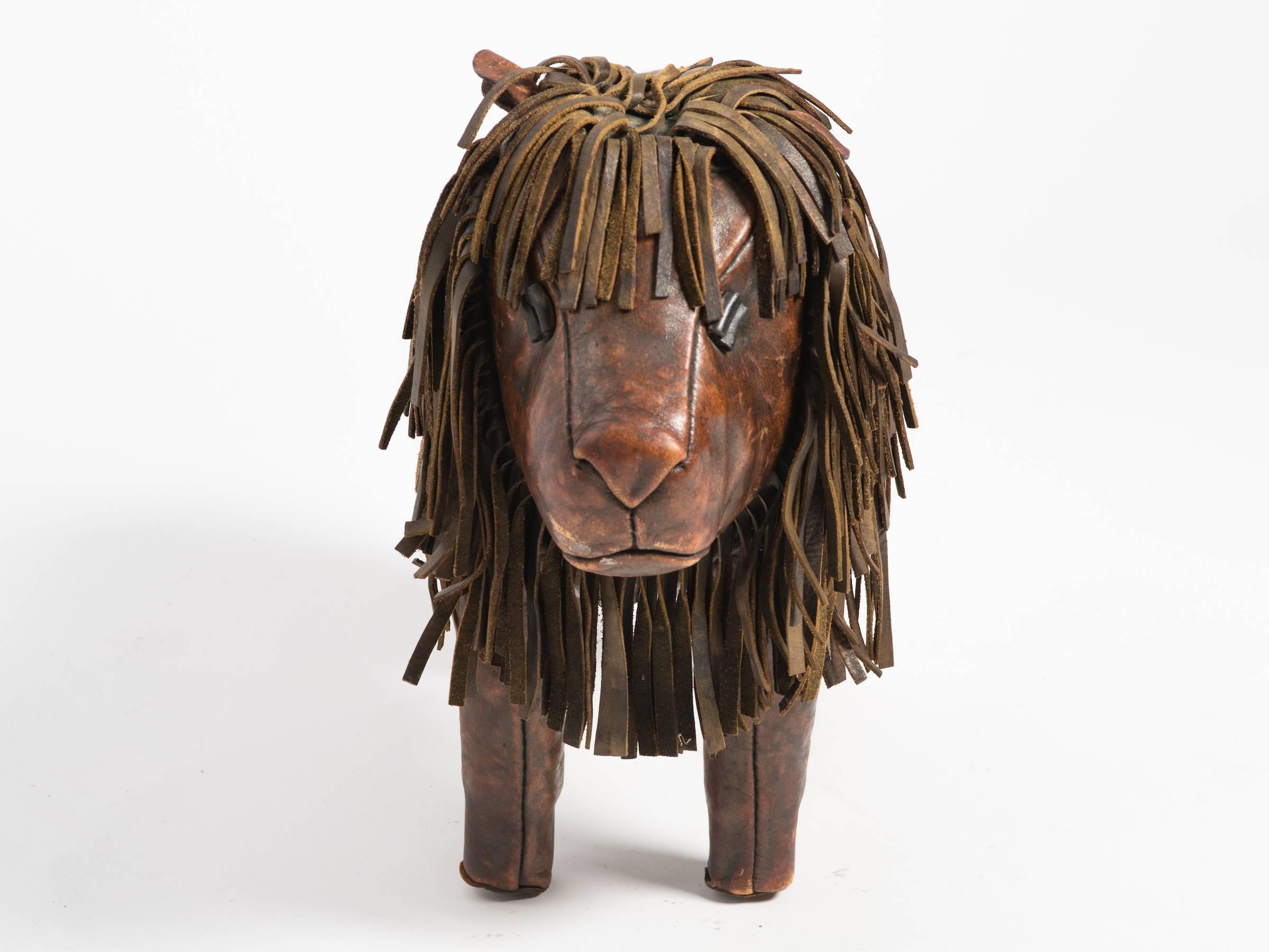 Leather lion footstool by Dimitri Omessa. Tail is missing.