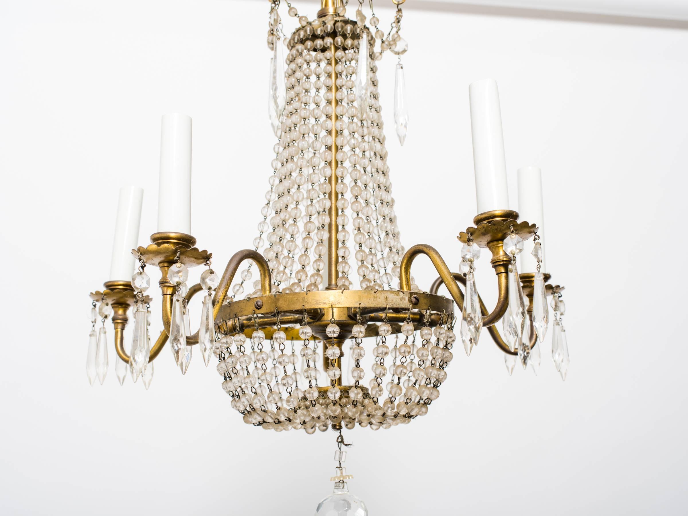 1950s French brass  beaded chandelier from the Ritz Carlton in NYC.