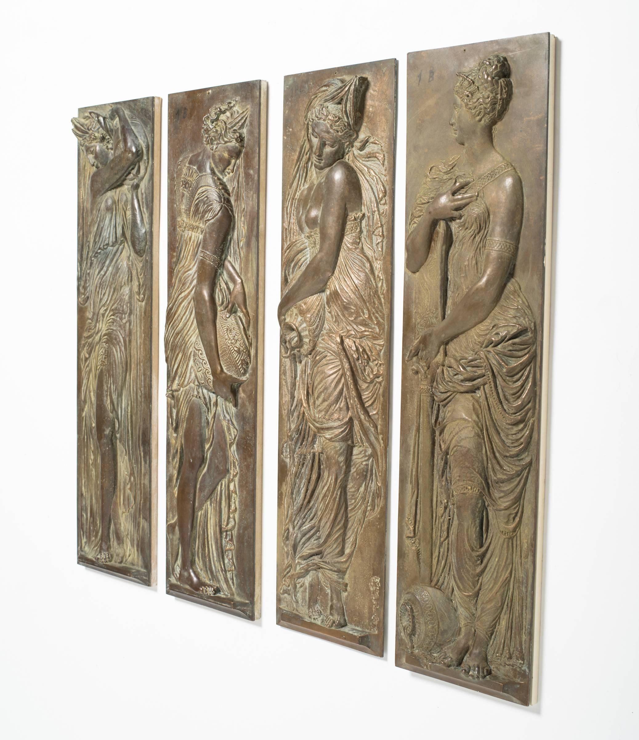 Four turn of the century bronze plaques of classical water maidens.