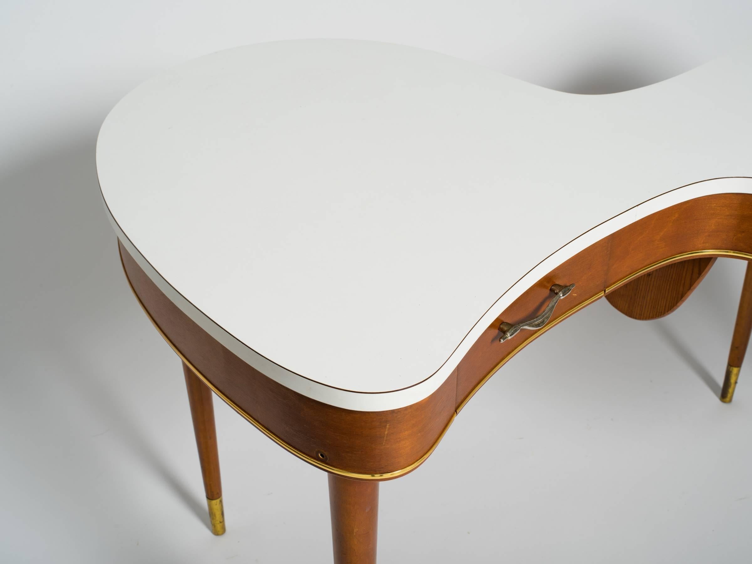 1940s organic shaped two-drawer desk with Formica top.