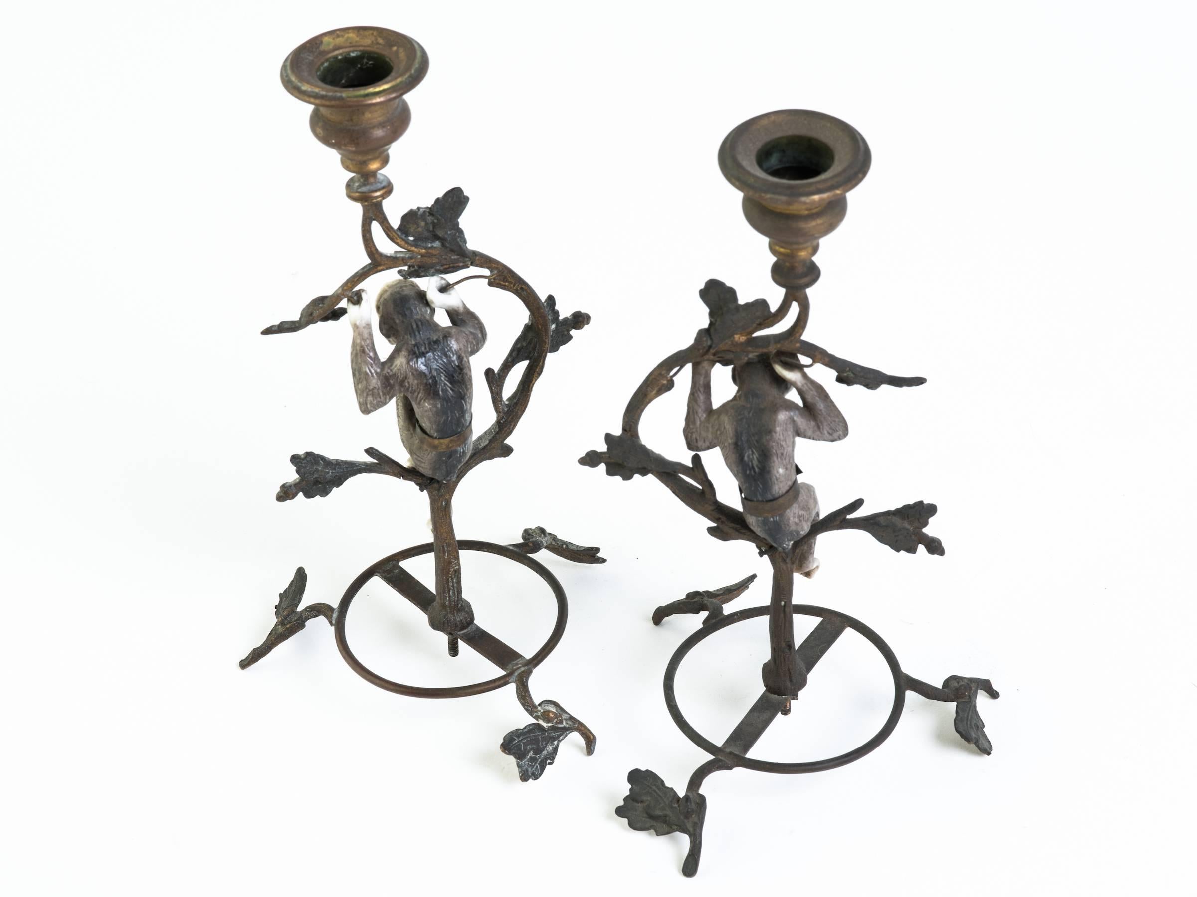 Unique pair of brass and porcelain Gibbon candlesticks from France, turn of the century.