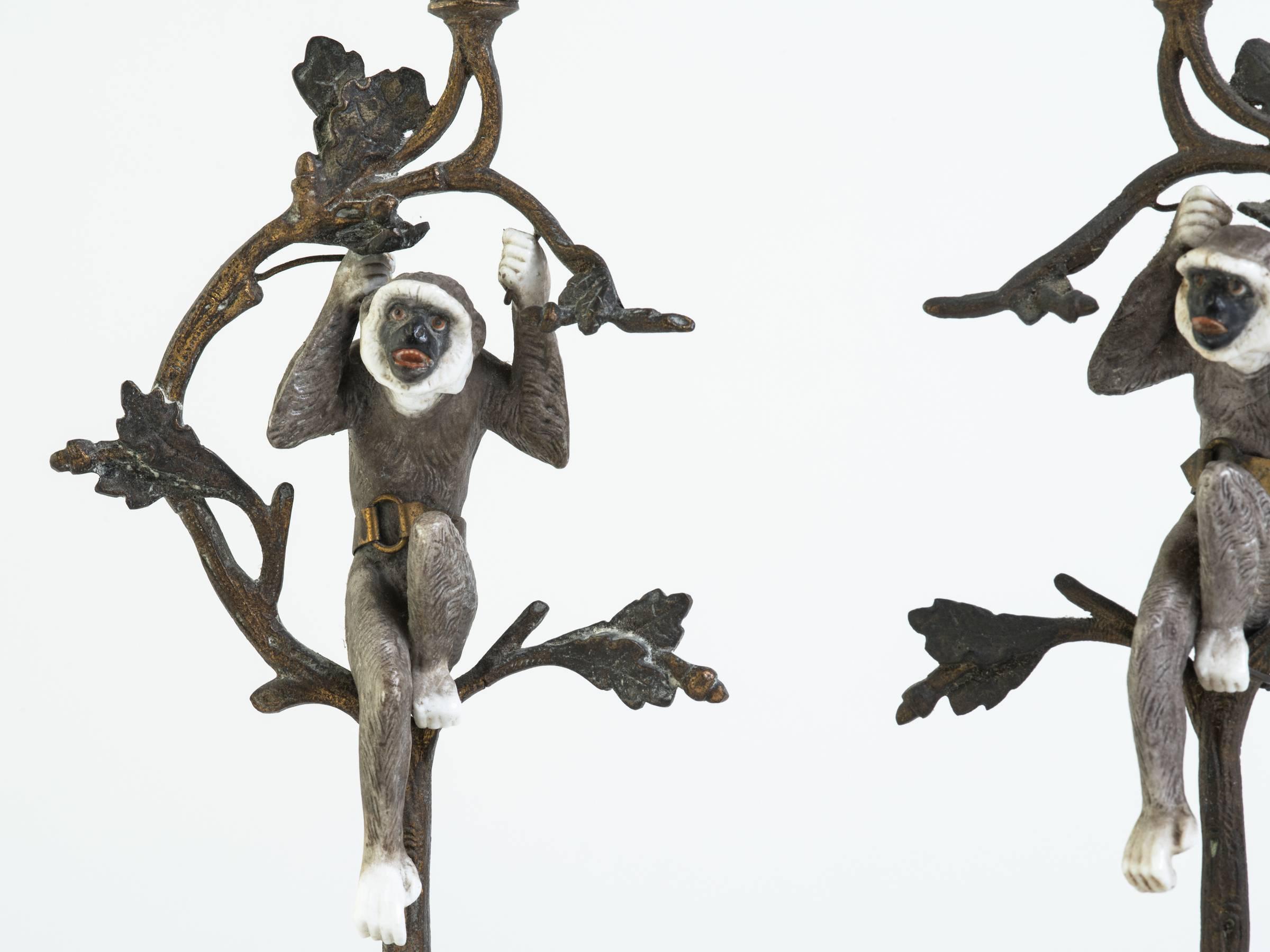 Early 20th Century Pair of French Turn of the Century Brass and Porcelain Monkey Candlesticks For Sale