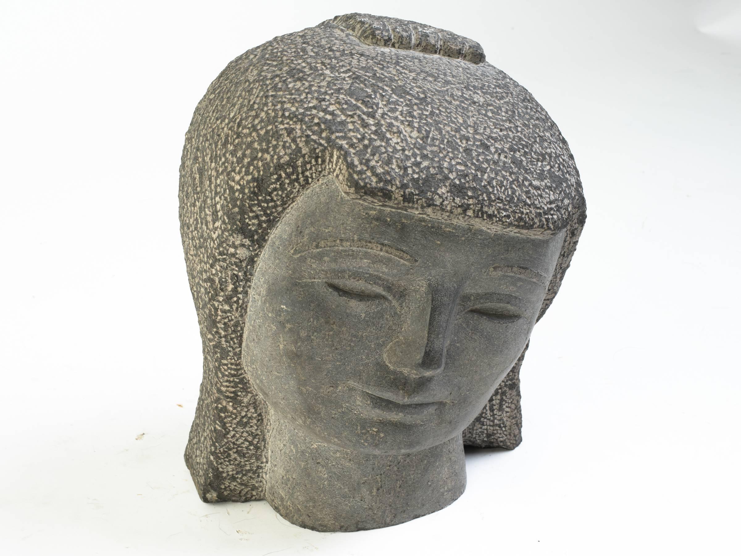 Carved stone Kwan Yin head from a Manhattan penthouse. Carved in Thailand from a solid piece of stone.