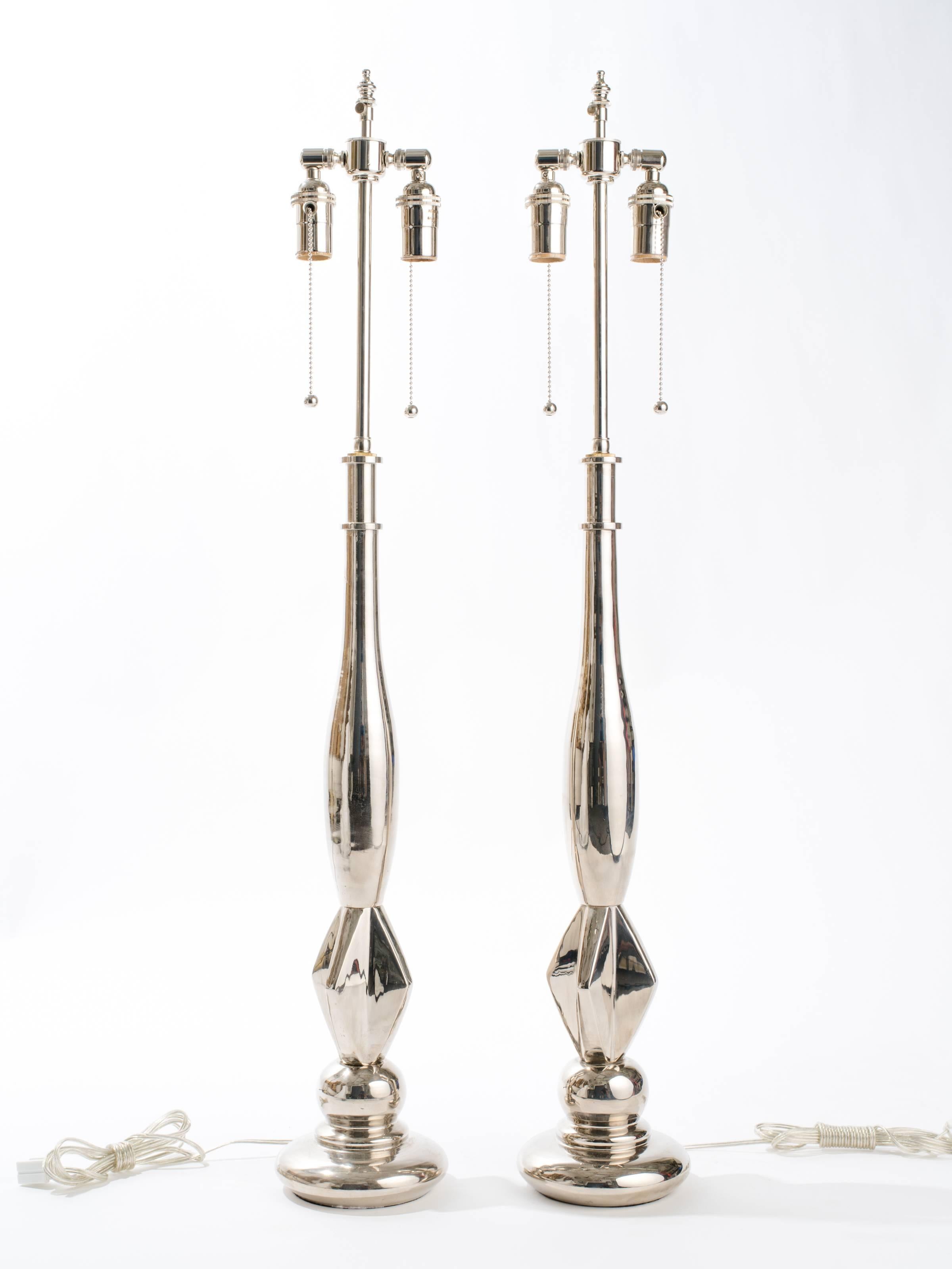 Elegant pair of nickel-plated metal lamps. Rewired with double pull chain sockets and adjustable height cluster.
