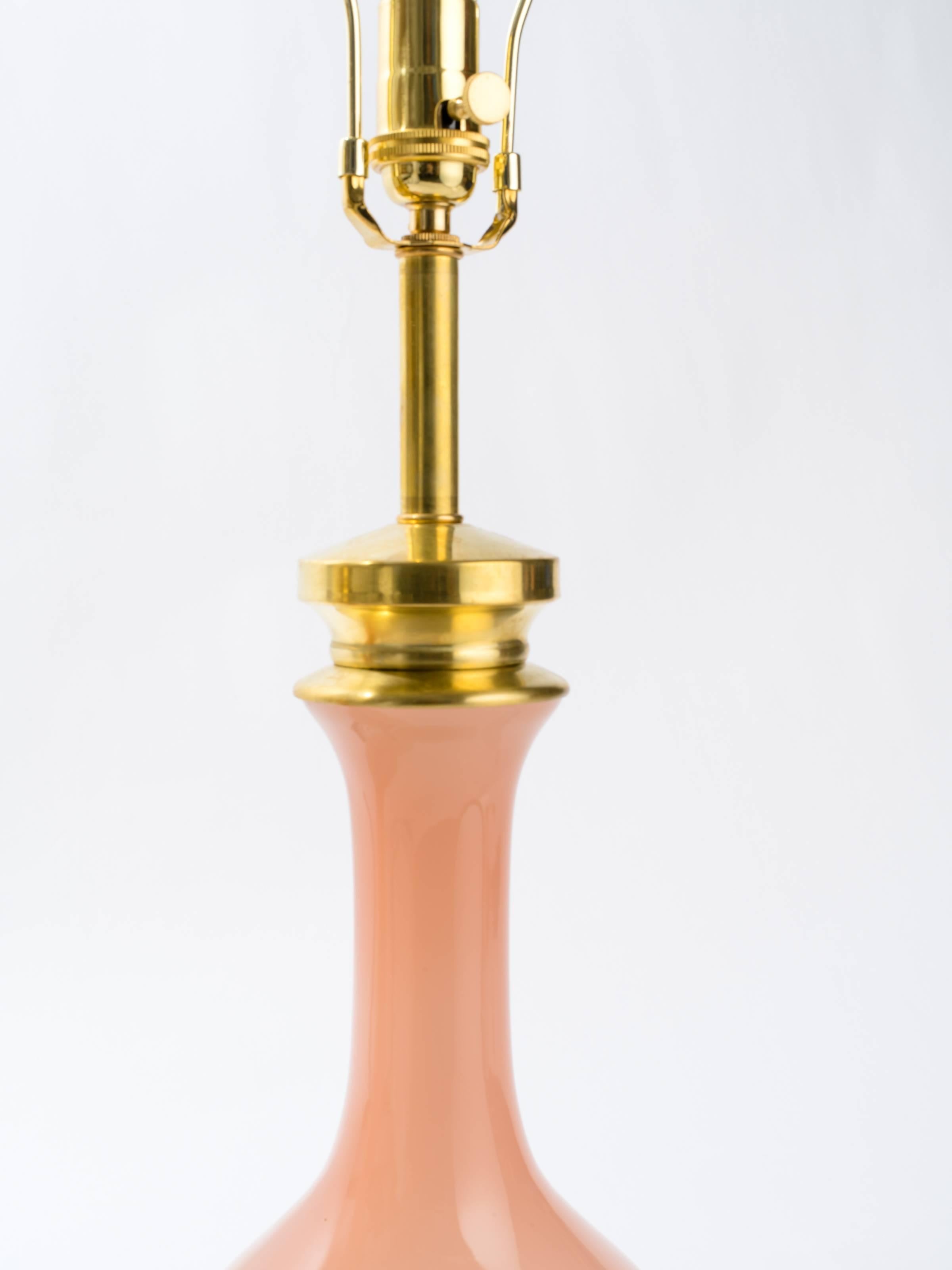 Pair of pink Murano glass lamps with brass hardware.
Restored and rewired with solid three way sockets
Each lamp measures 31