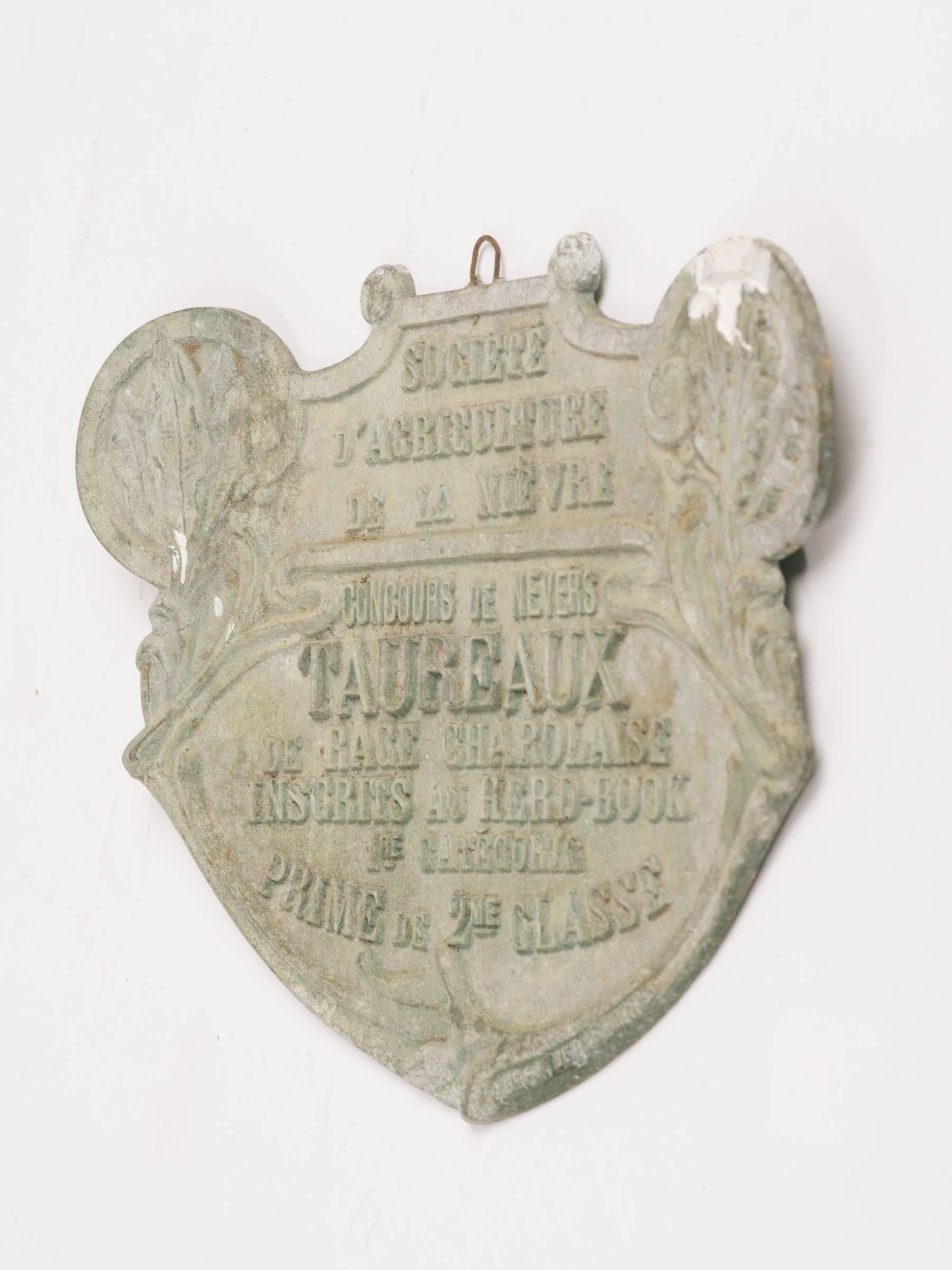 1940s French lead plaque stating that this bull won second place in an agricultural show.