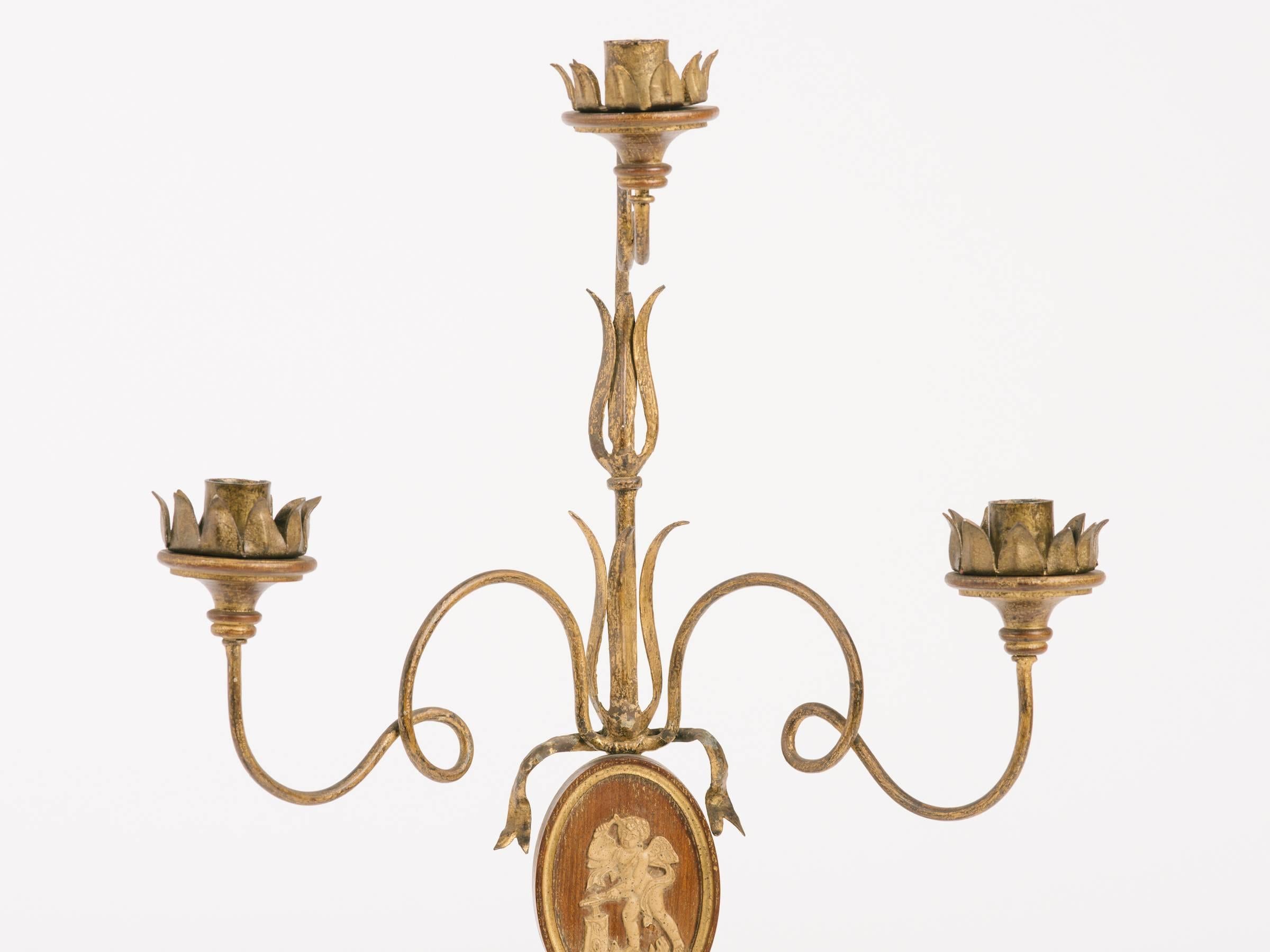 1950s Italian wood candlestick with gesso plaque of angels. Gilt metal bobeches.