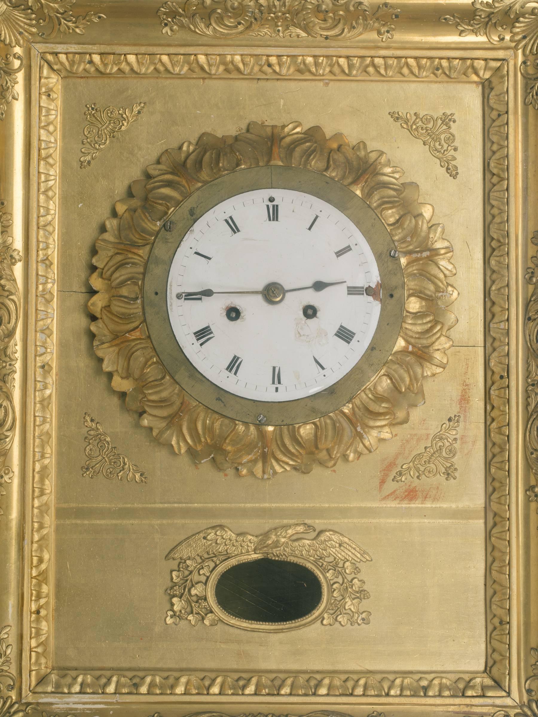 19th century French gilt wall clock. There is a brass pendulum that comes with this clock, but it was unfortunately not photographed . It was found after the clock was photographed. The clock does not work, there is no key. But it sure is pretty!