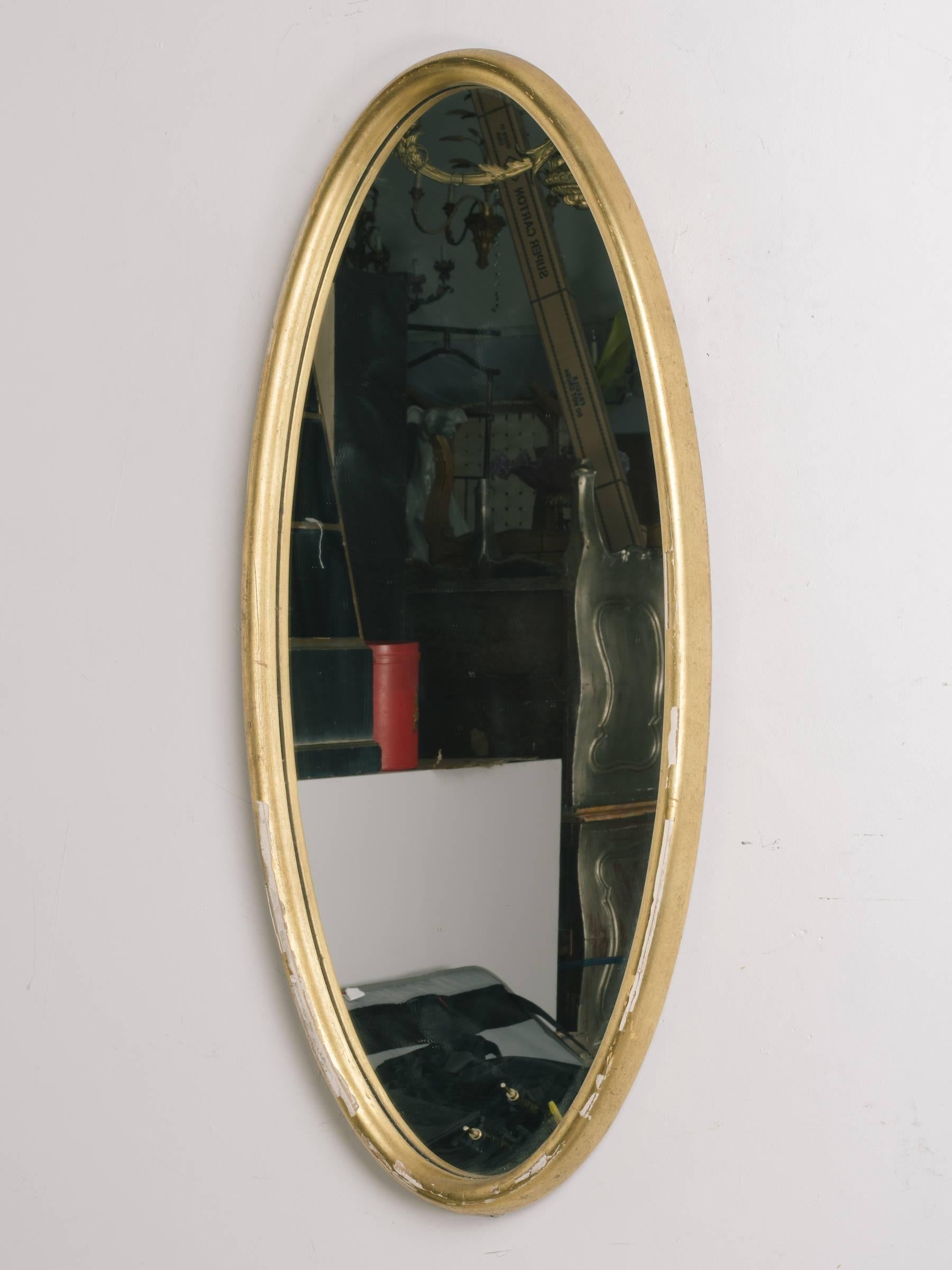 Oval gilt deep framed Italian mirror. Frame has gilt missing.