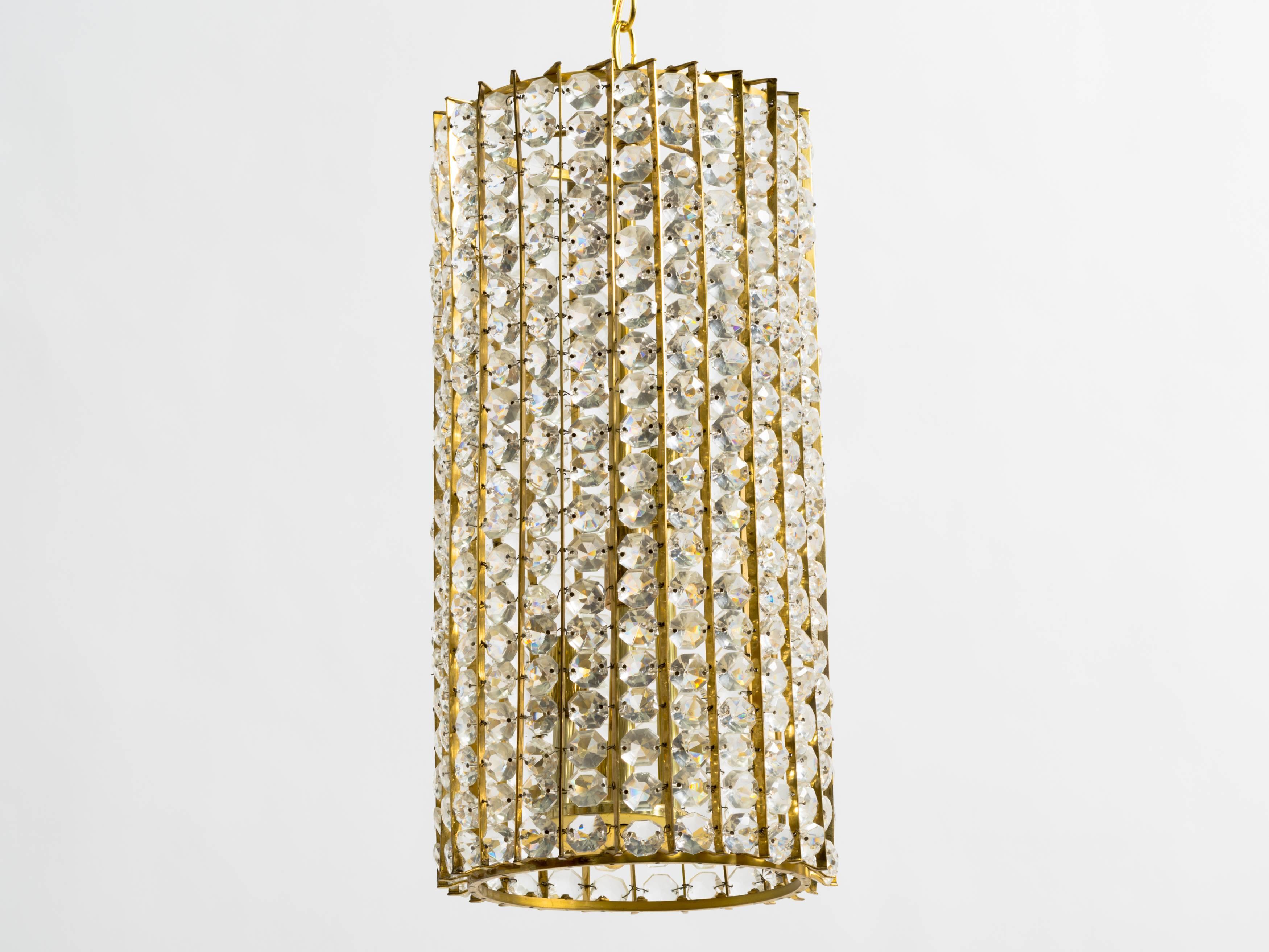 Faceted crystal bead chandelier.
Each crystal is individually attached to brass frame.
Professionally restored and wired.
Four candelabra Max 75W per socket
Italian, 1950s.
Height of only cylinder is 18.5