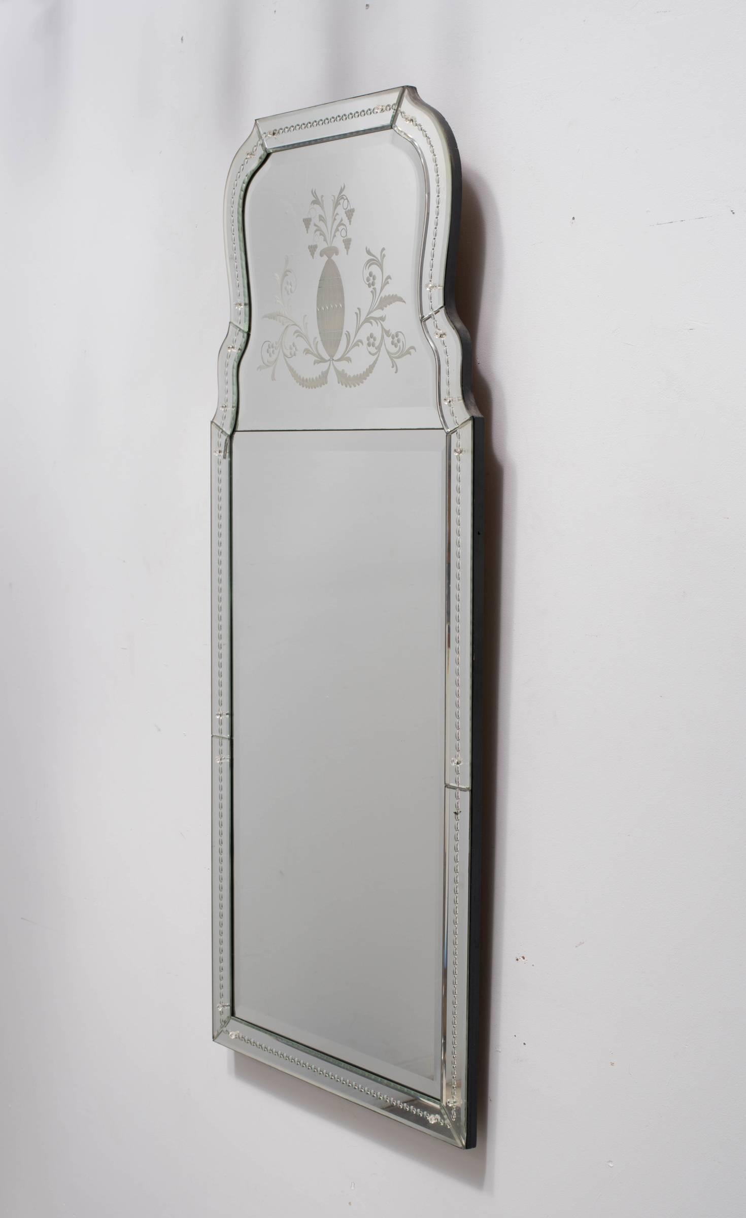 1960s Venetian etched mirror. The mirror has a crack in it on the left hand side about 1 inch long.