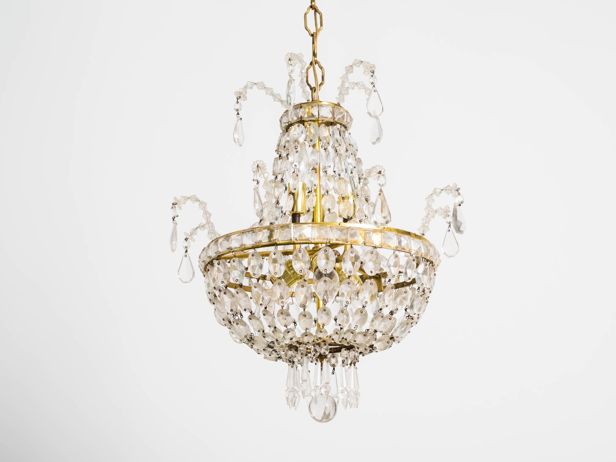 Elegant French style crystal and brass chandelier.