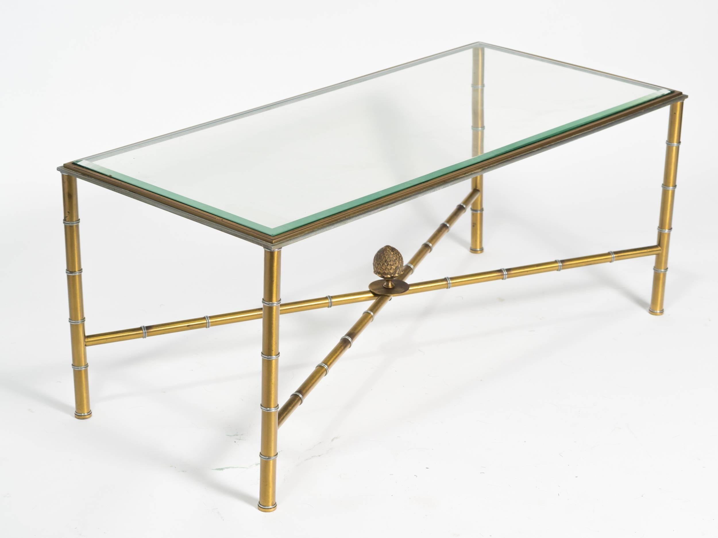 1950s faux bamboo coffee table with glass top.