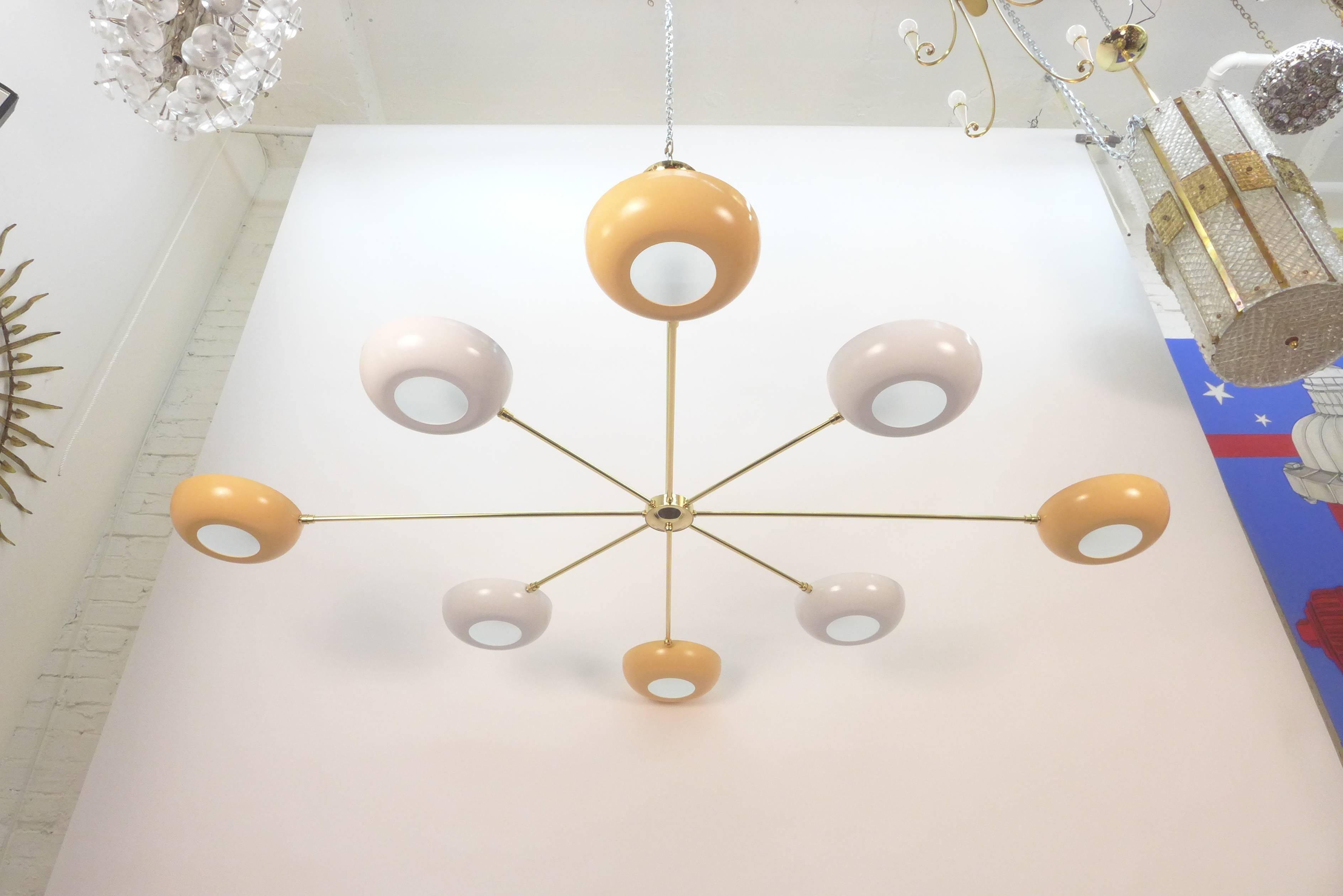 Eight arm chandelier in the style of Stilnovo. Frosted glass fittings at the bottom of each standard base (E26) socket.
It can be ordered in multiples and customized with different finishes and colors.
Newly wired.
Max. 100 watts per socket.
 