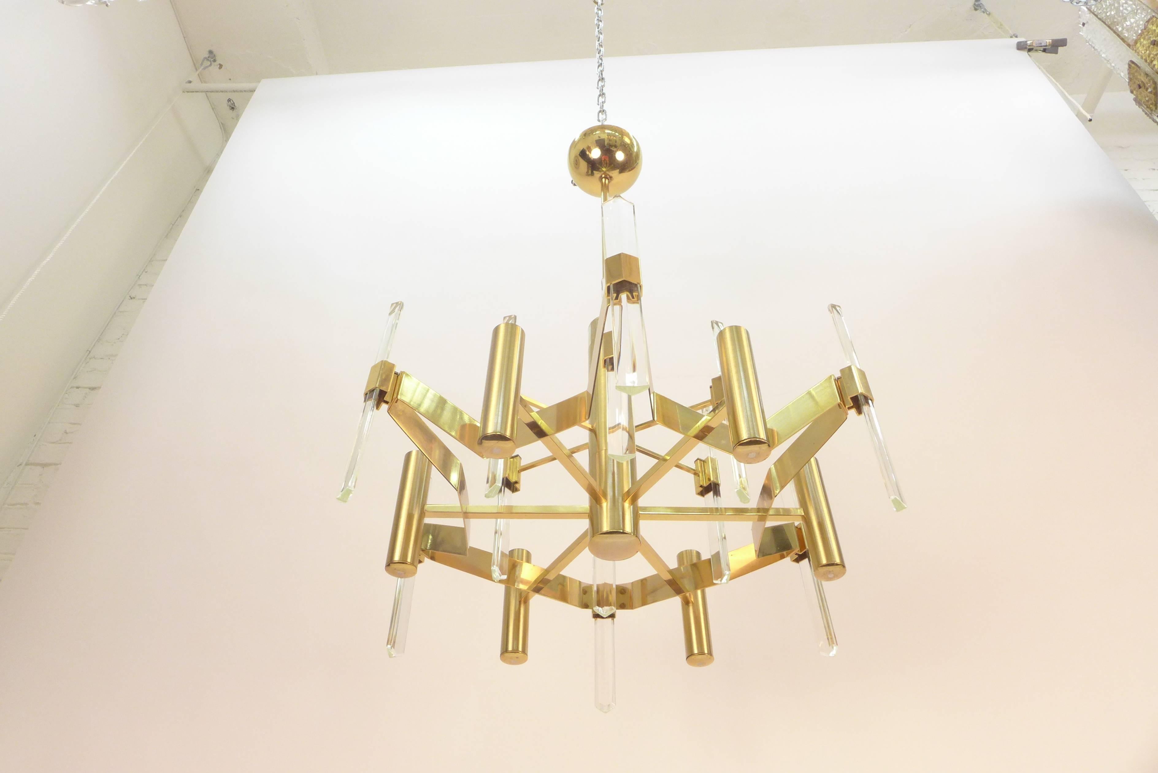 Gold-plated metal and faceted crystal chandelier by Gaetano Sciolari. 
Rewired for US.
Nine candelabra sockets. Max 60 watt per socket.
 