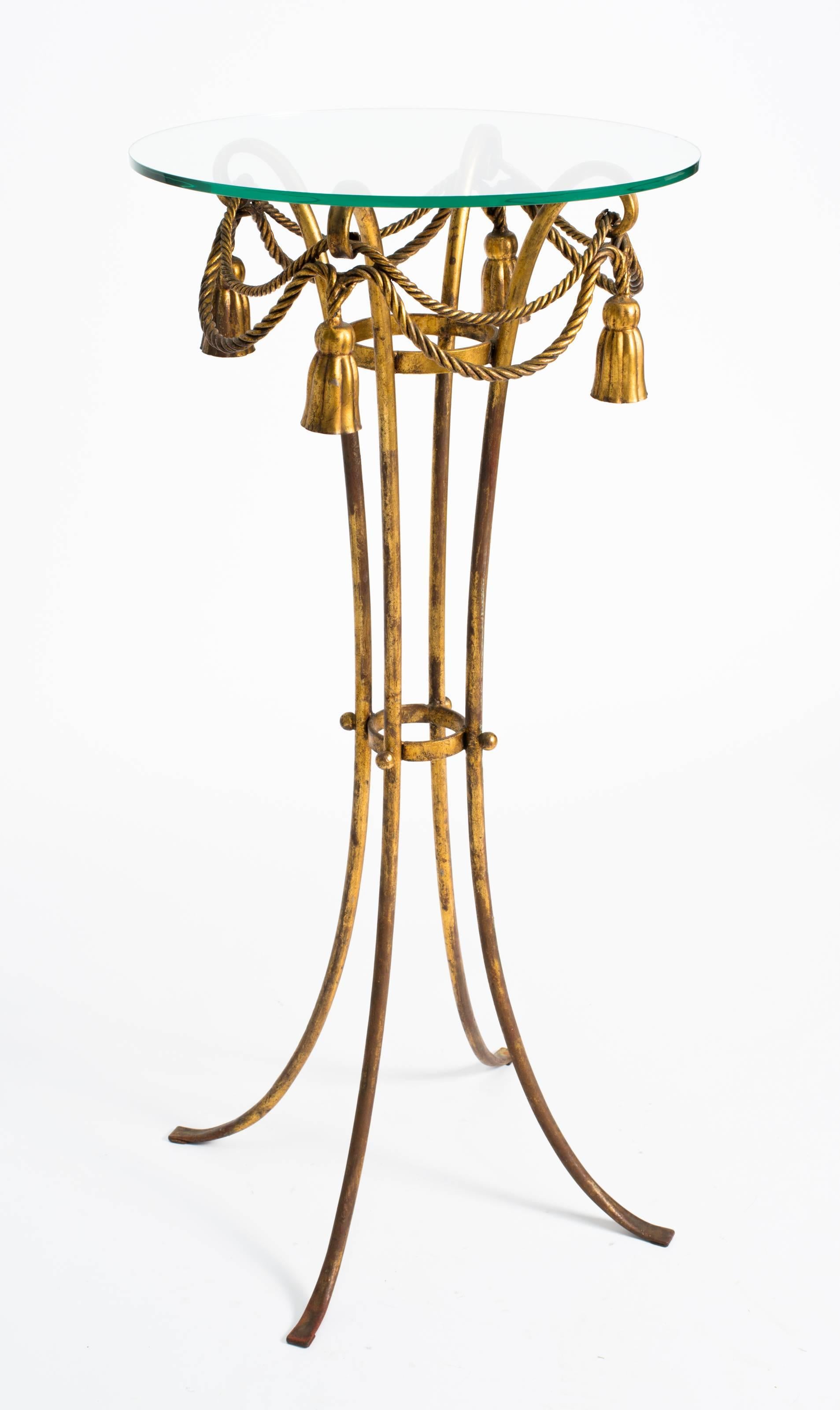 Italian gilt metal tassel pedestal or fern stand with glass top.