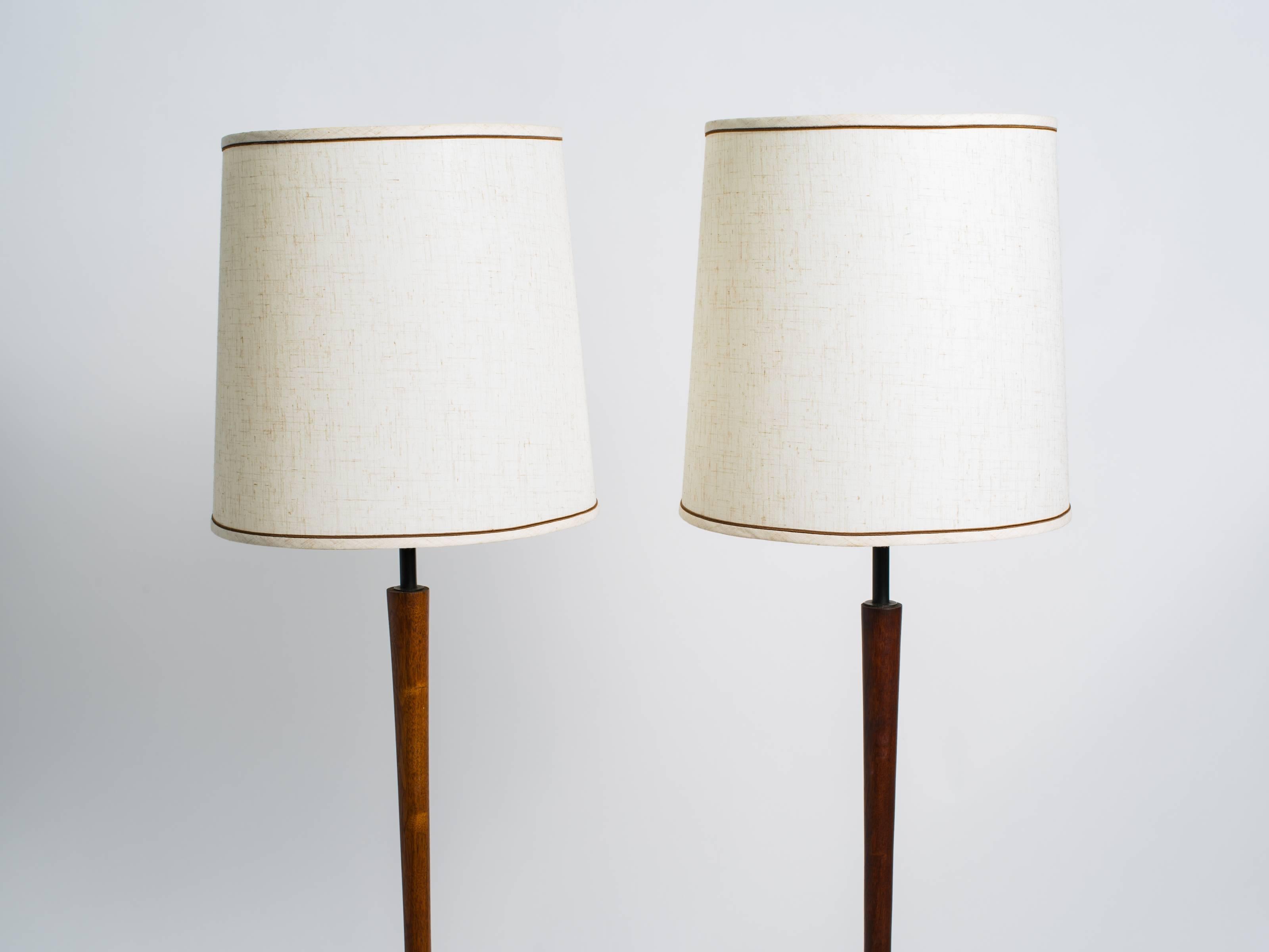 Pair of Danish modern teak floor lamps. One is 1/2