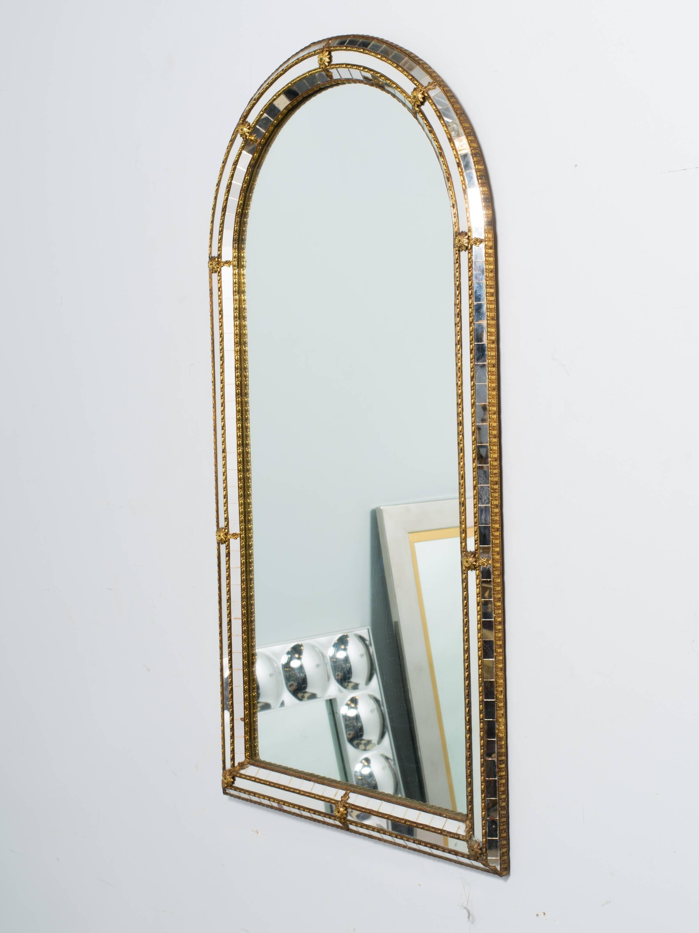 Italian mosaic wall mirror with brass accents.