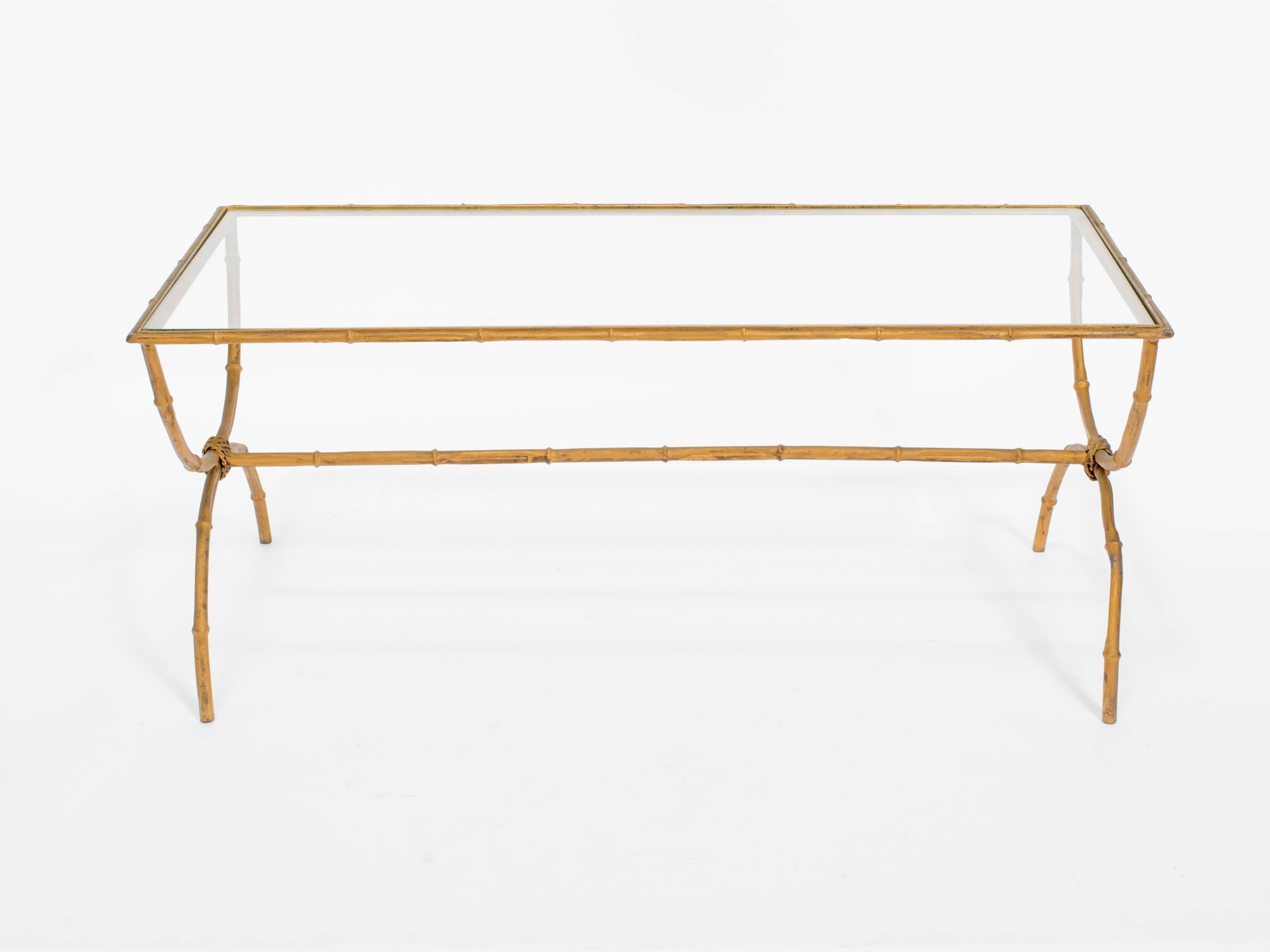 Gilt metal faux bamboo coffee table with glass top.