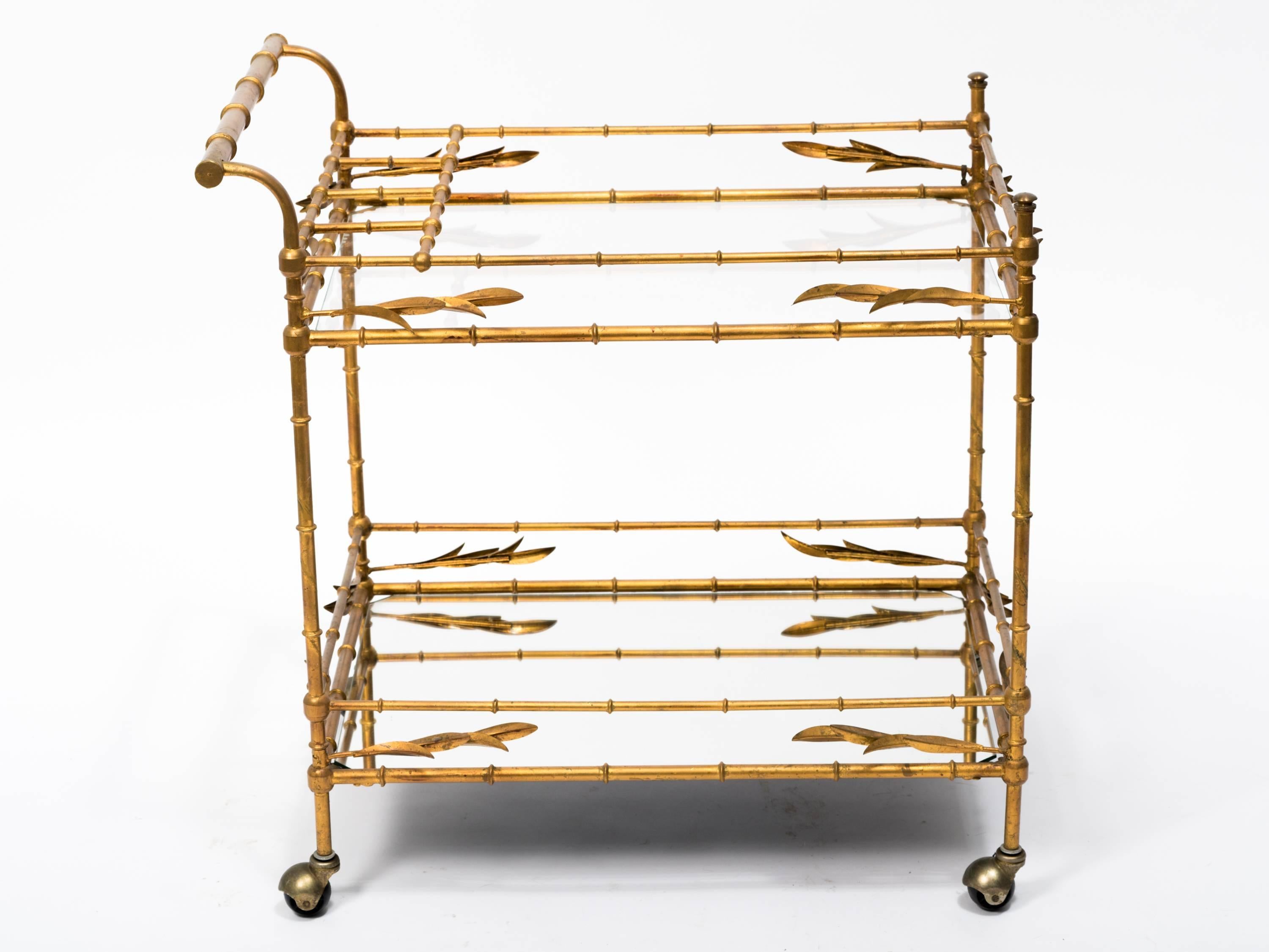 Faux bamboo gilt metal and glass serving cart. Made in Italy. Mirror glass on the bottom, clear on the top.