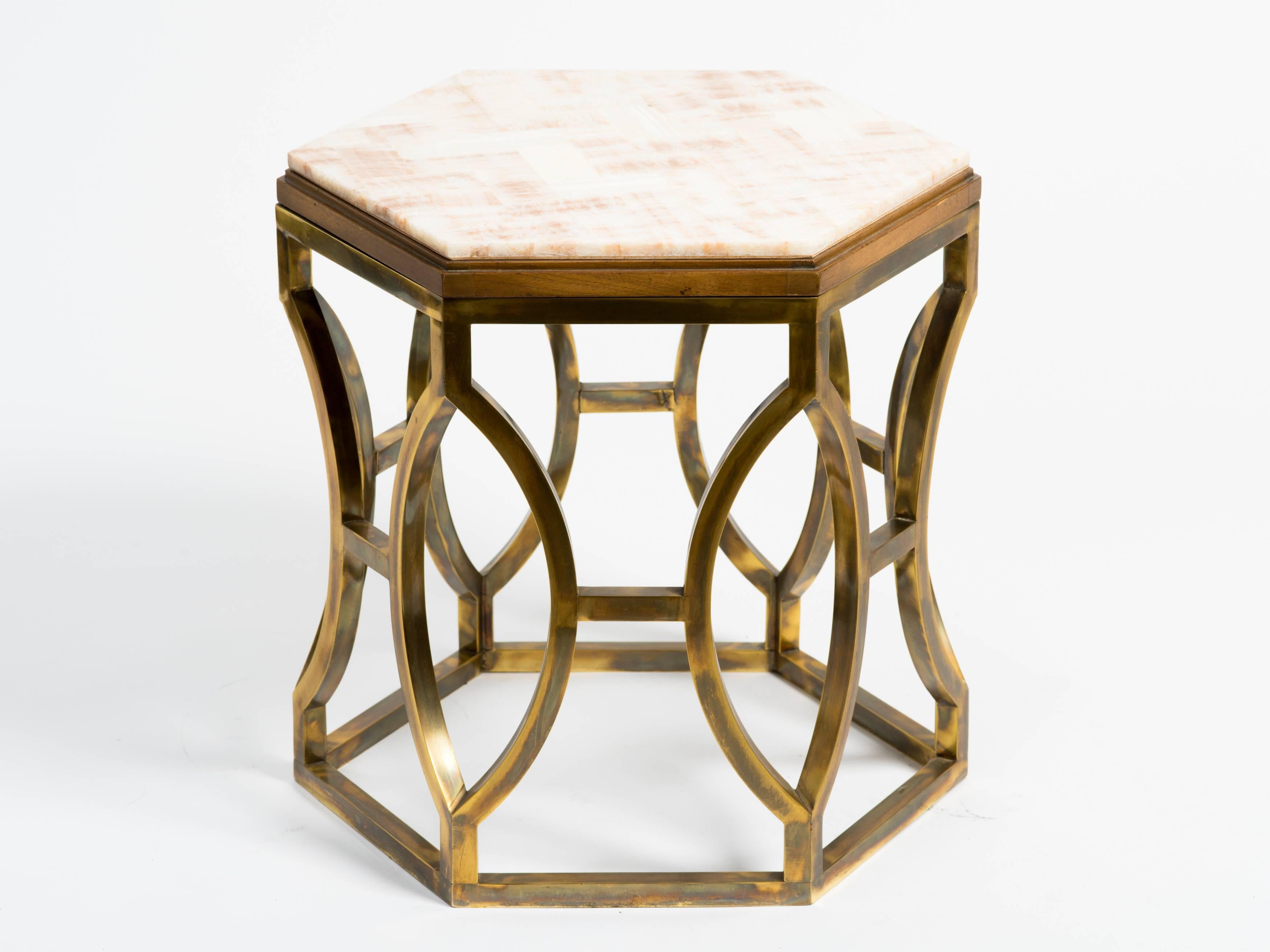 Hollywood Regency style brass and polished stone occasional table.