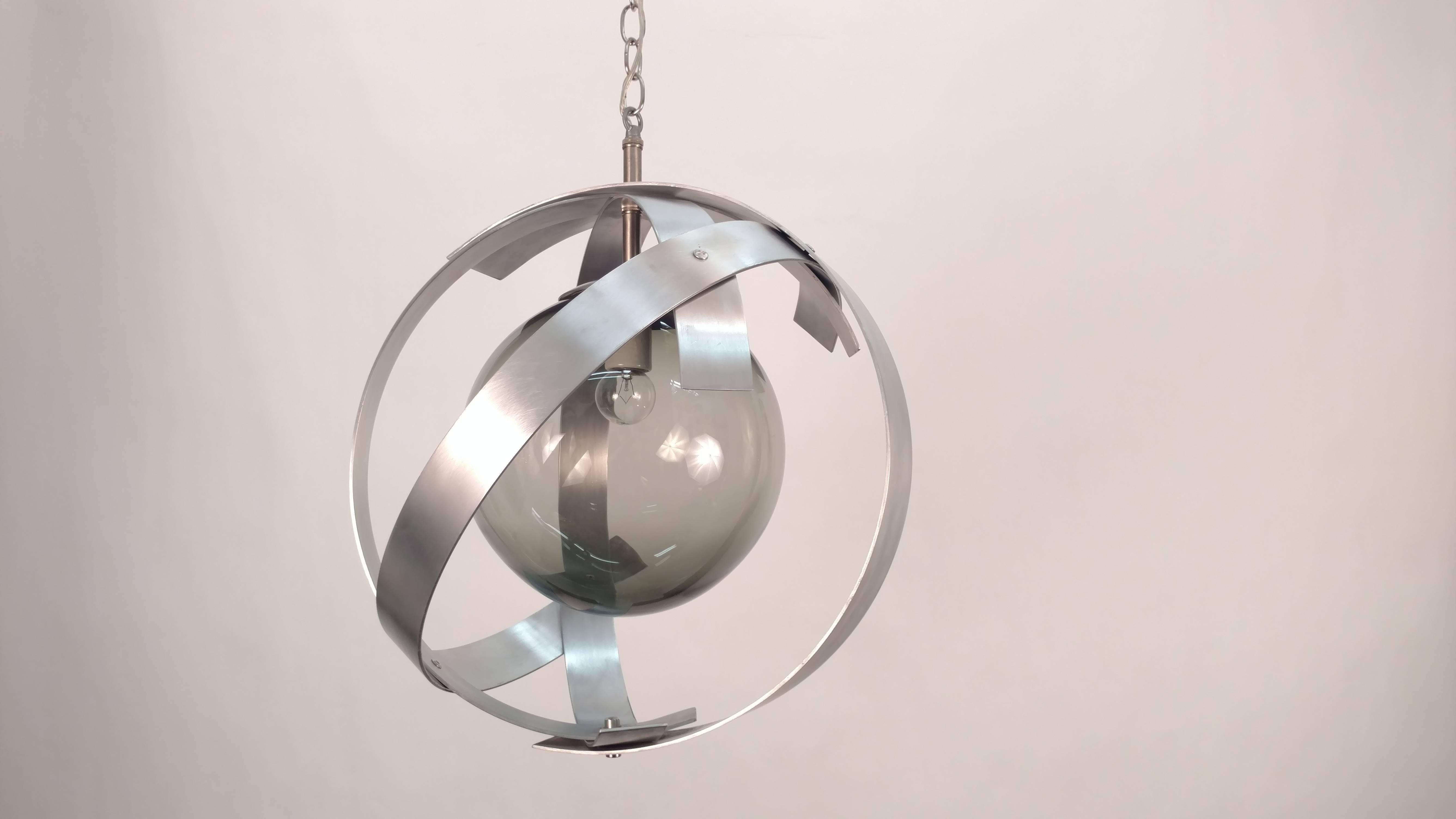 Orbit aluminium frames with smoked glass globes.
Newly wired.
Two different sizes:
Main picture: Two side fixtures are 36in H x 16in D
Middle pendant is 39in H x 18in D.

  
