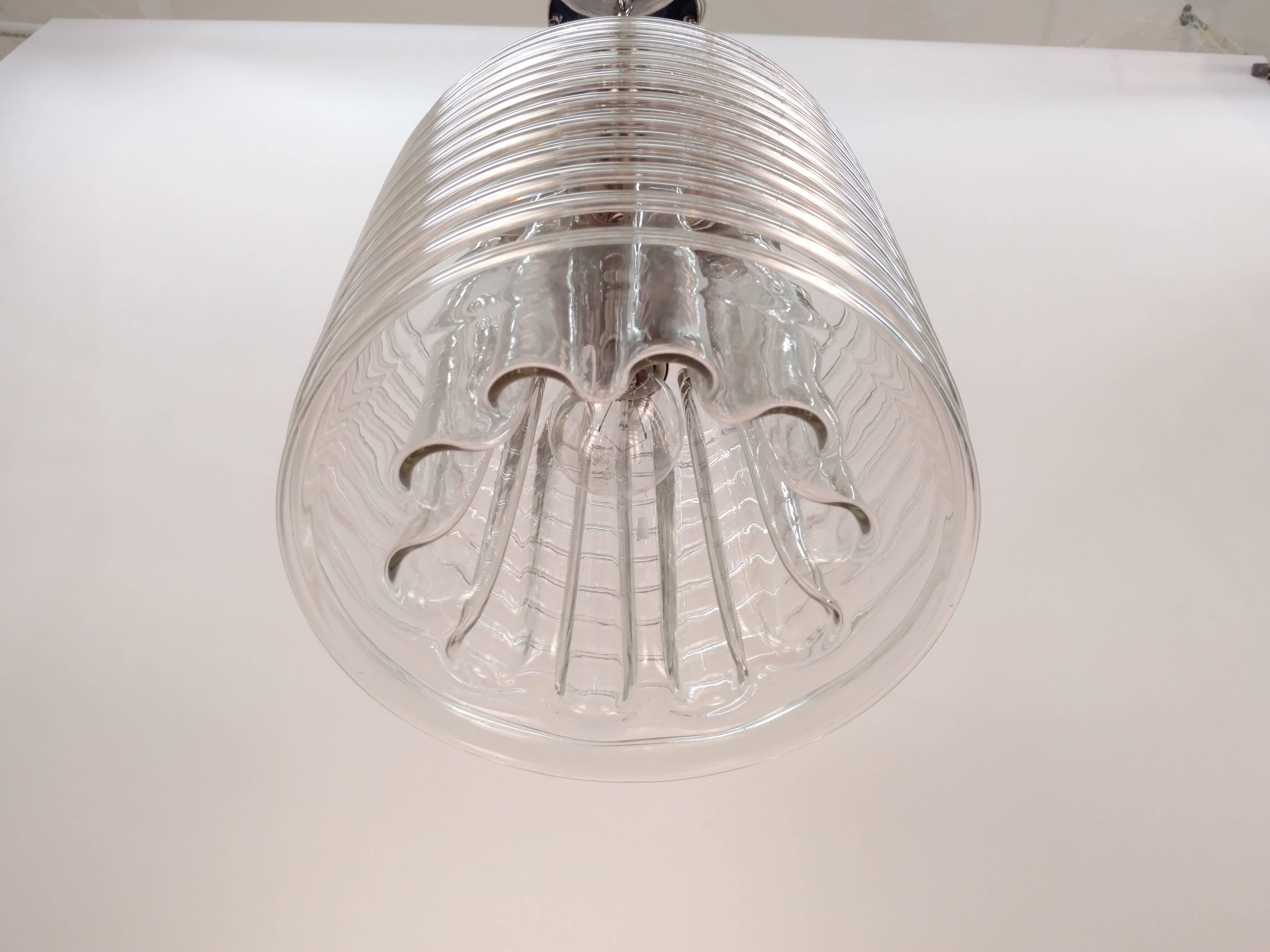 Exquisite glass shade.
Newly wired with medium base socket. Max 100 Watt
Measurements:
28in H to the canopy and 11in H only the glass part
11in D.