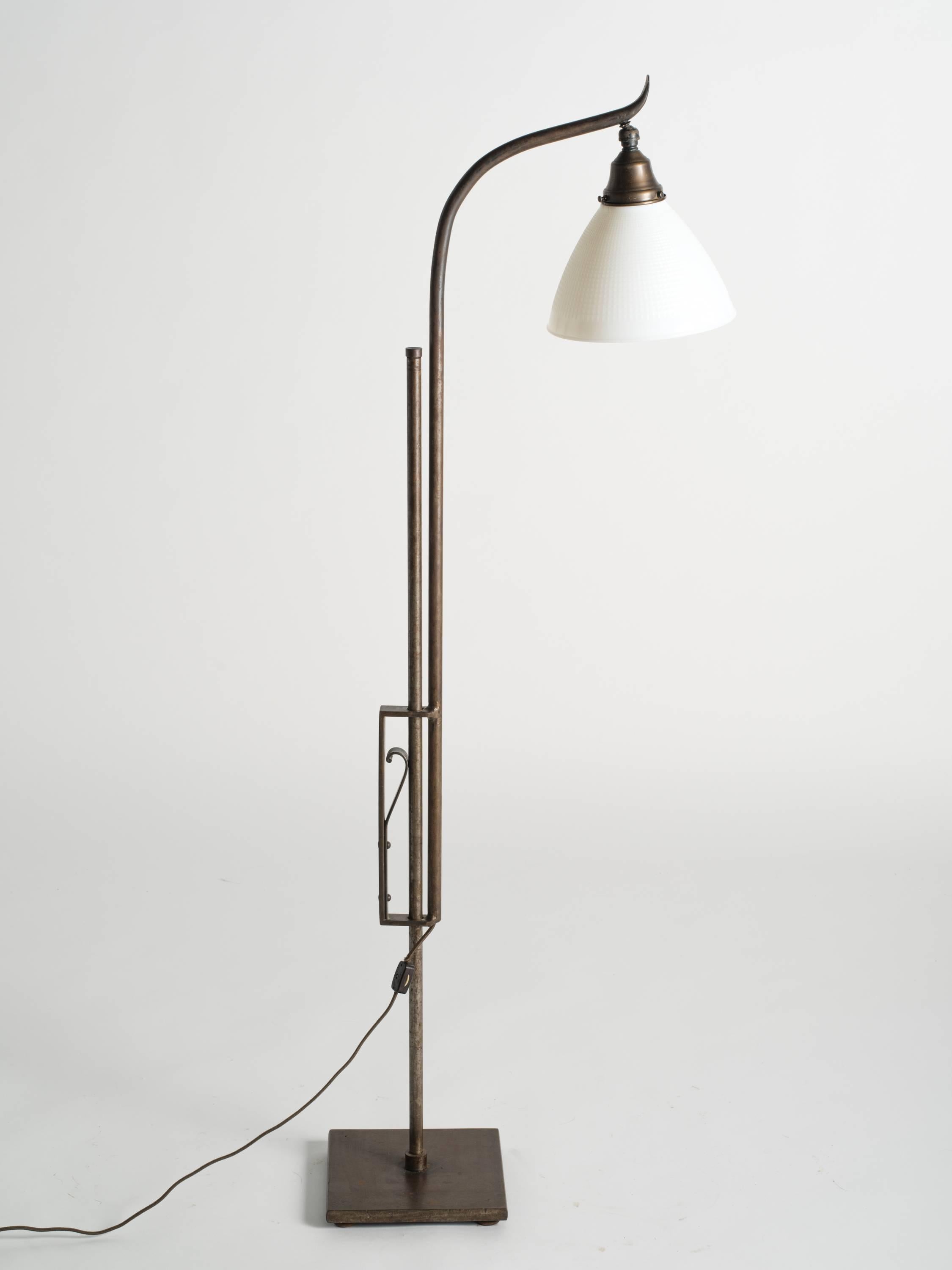 Iron Art Deco style adjustable height floor lamp with milk glass shade. Measure: Height adjusts from 38