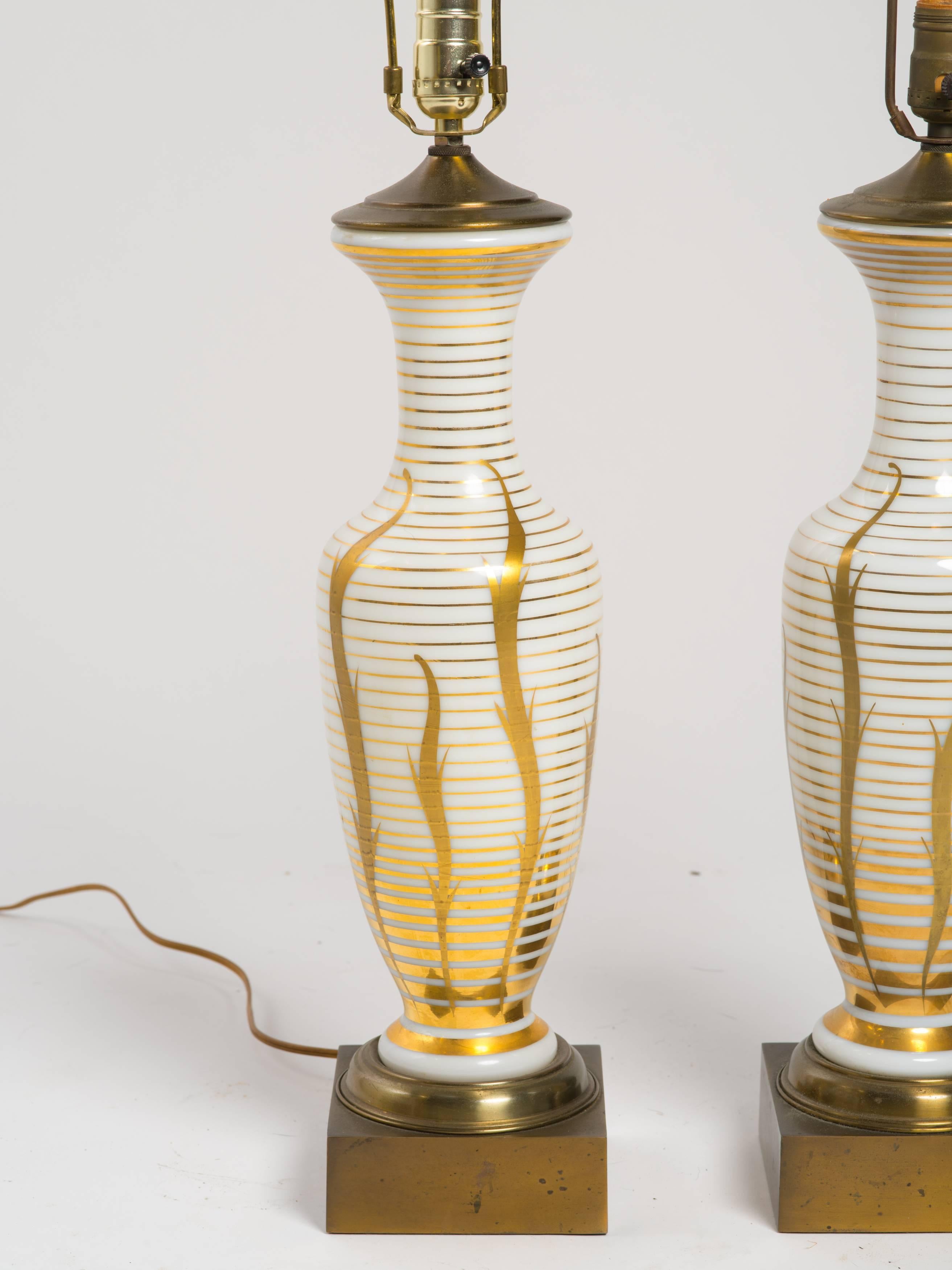 Pair of hand-painted brass and glass table lamps.