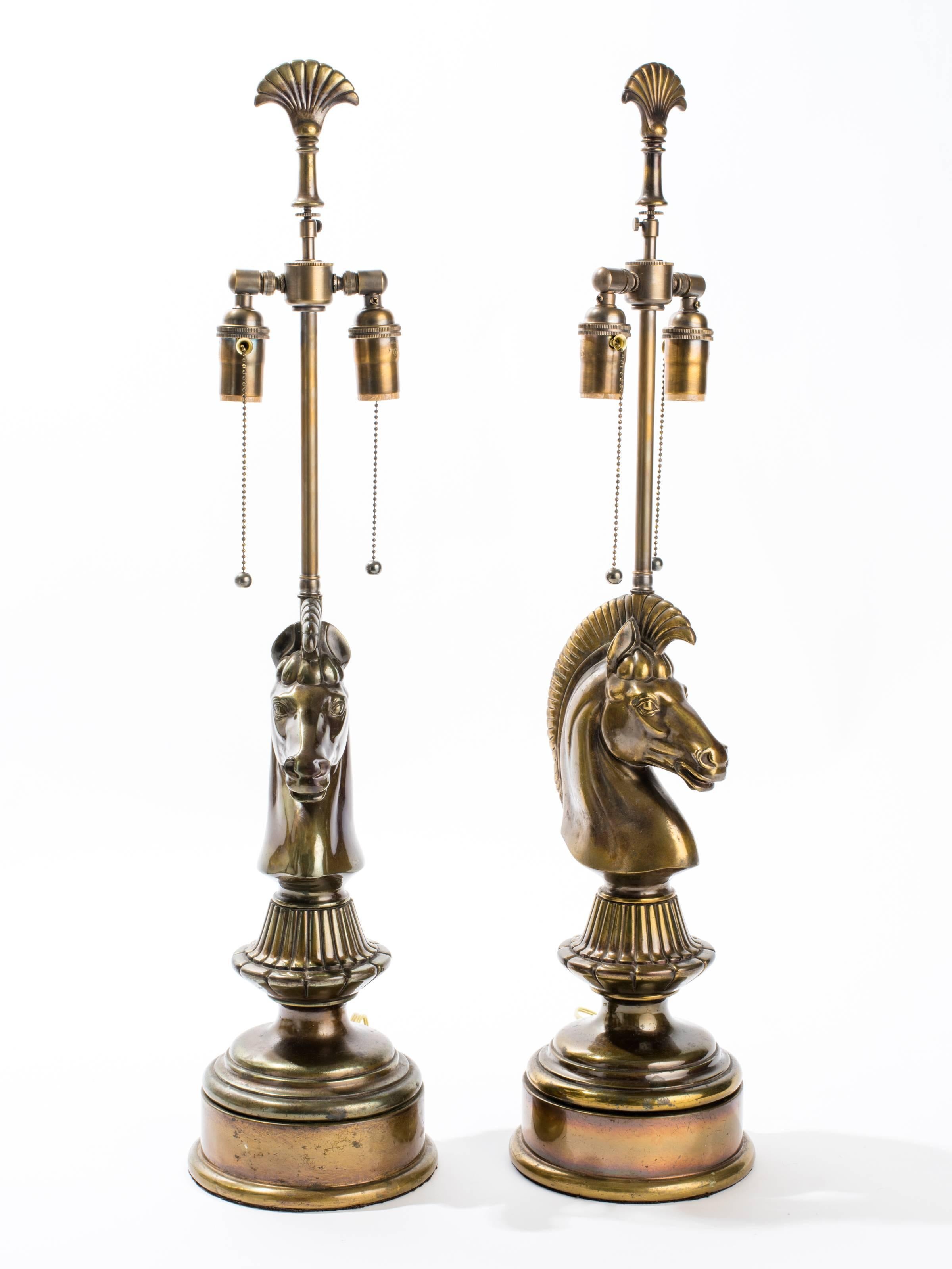 Pair of vintage cast metal horse head lamps with bronze finish.
Rewired with double pull chain sockets.