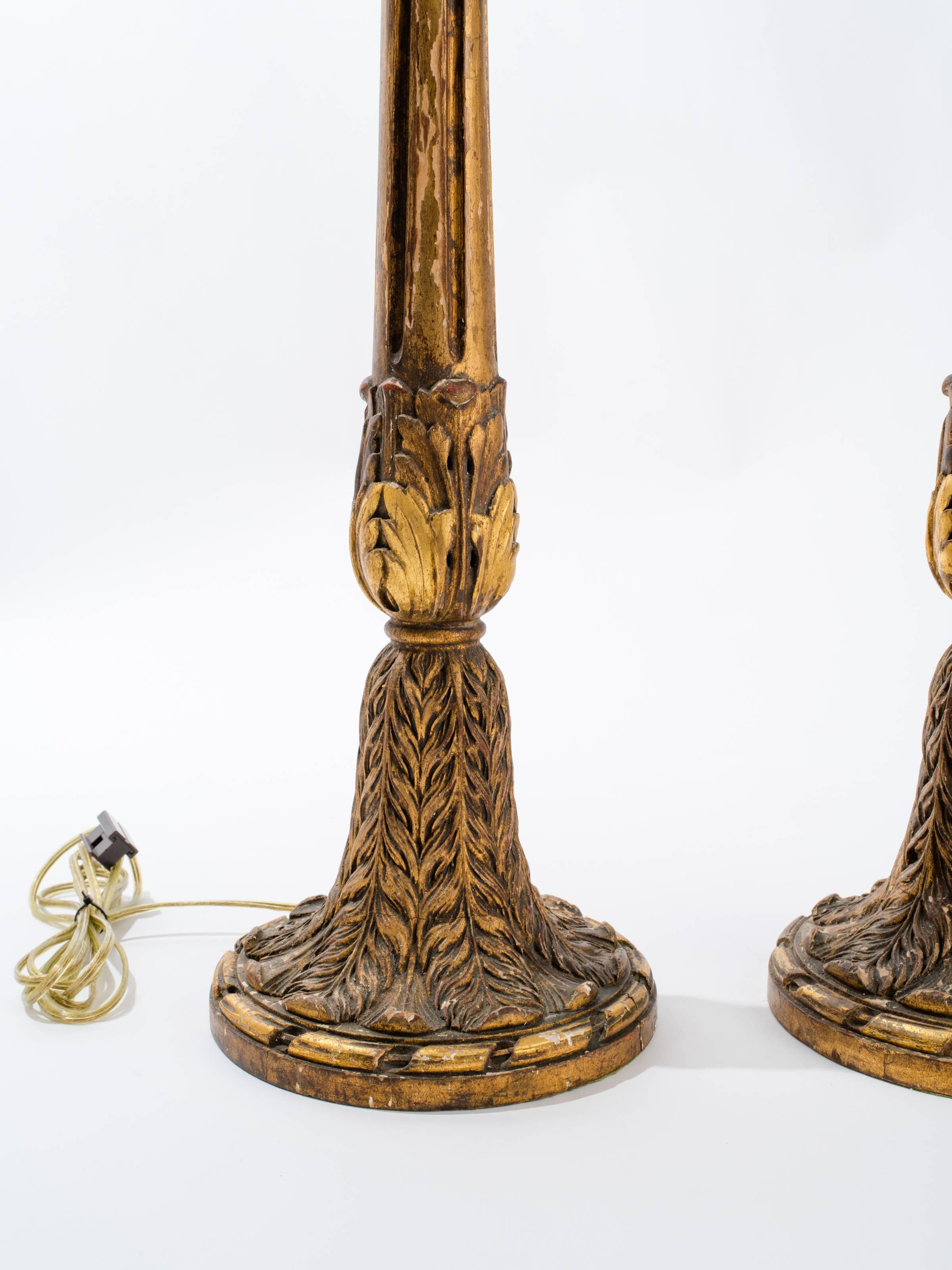 Early 29th century carved wood lamps.
Rewired with new double pull chain brass sockets.
Adjustable height.