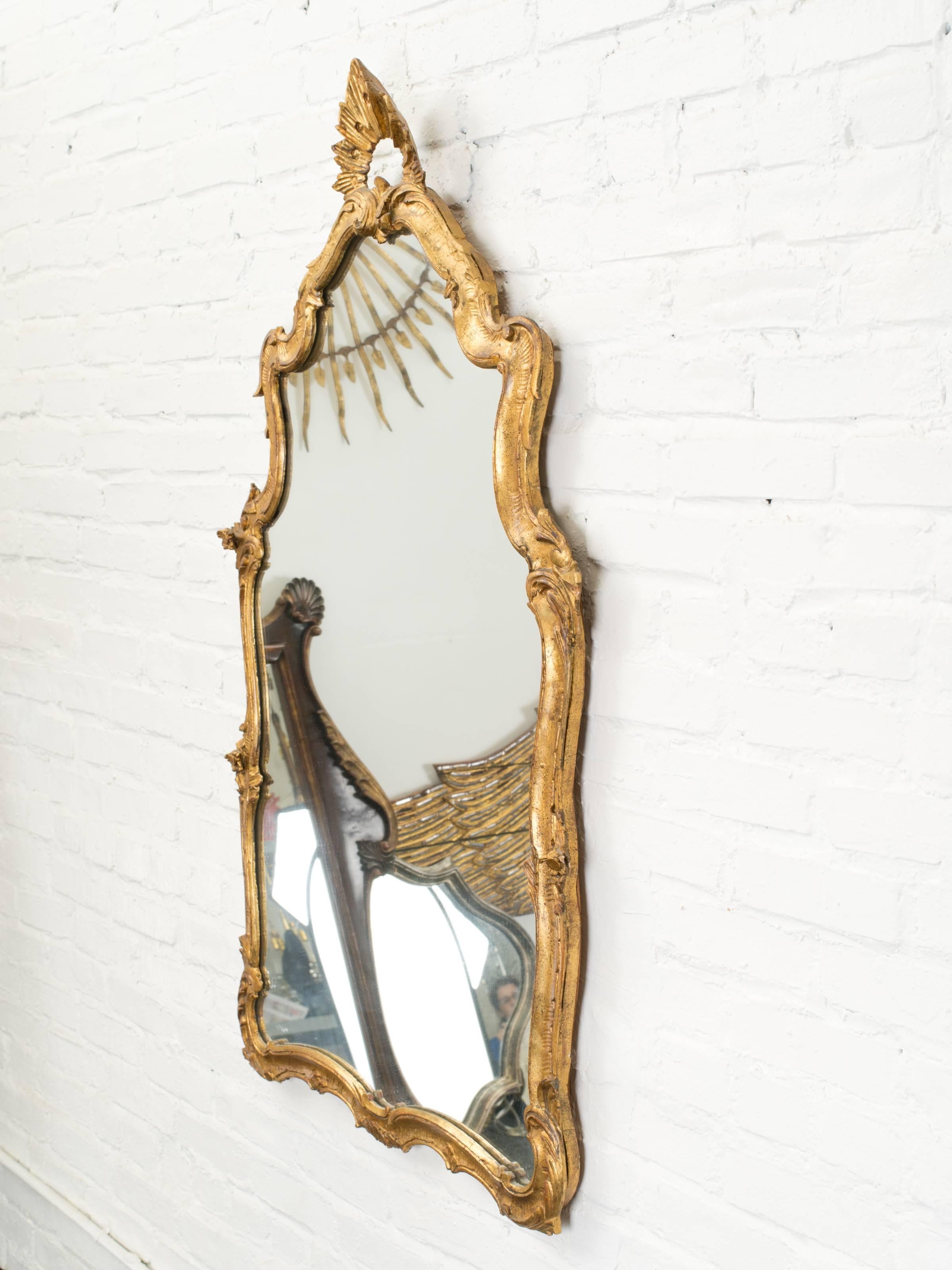 Italian gilded mirror in Rococo style.