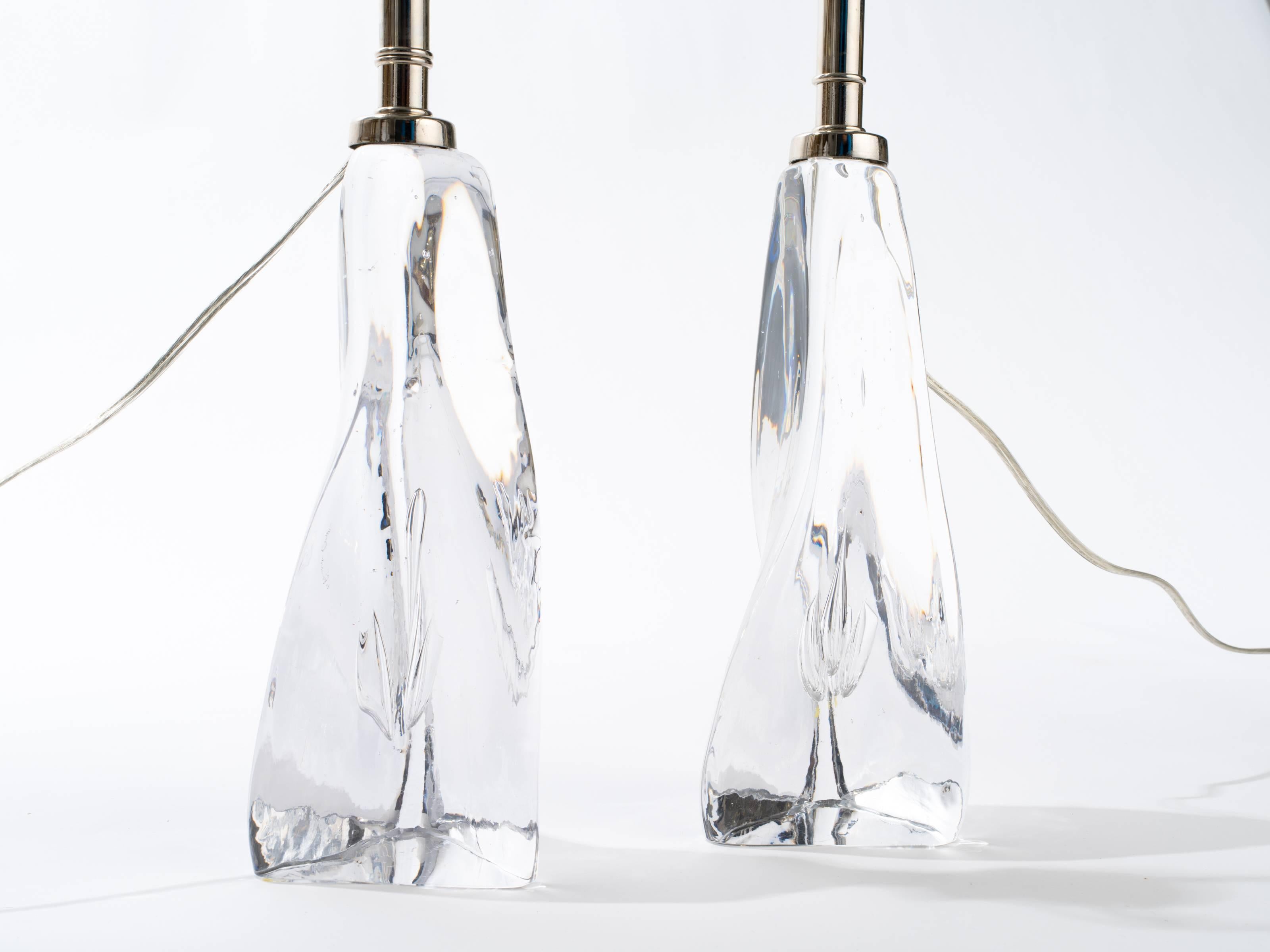Exquisite art glass table lamps.
The glass on each lamp is handblown, not molded. Each lamp is absolutely unique.
Probably by Orrefors, Sweden, circa 1950s
New polished nickel hardware and wiring.