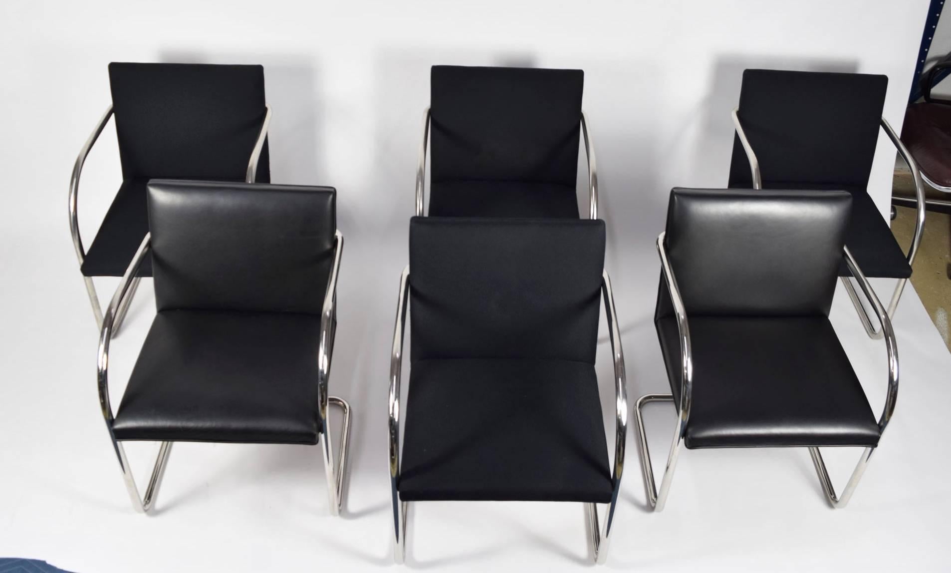 We have a set of six Brno chairs by Knoll in polished stainless steel. Two are in black leather and can be sold separately. The remaining four are in need of reupholstery. The entire set can be reupholstered in a fabric of choice. We are happy to