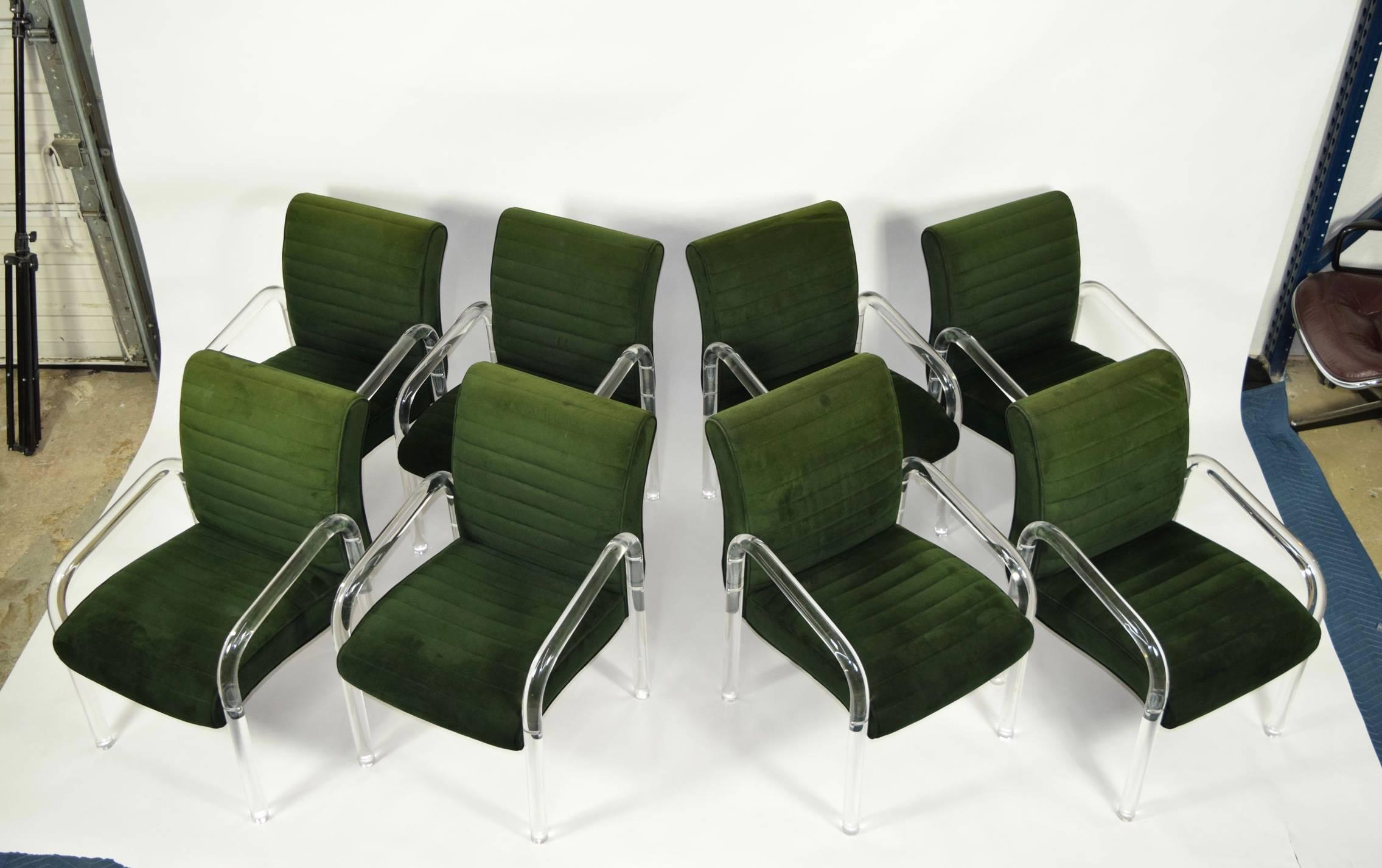 Set of eight lion in frost dining chairs with Lucite frame and upholstered seat and back.