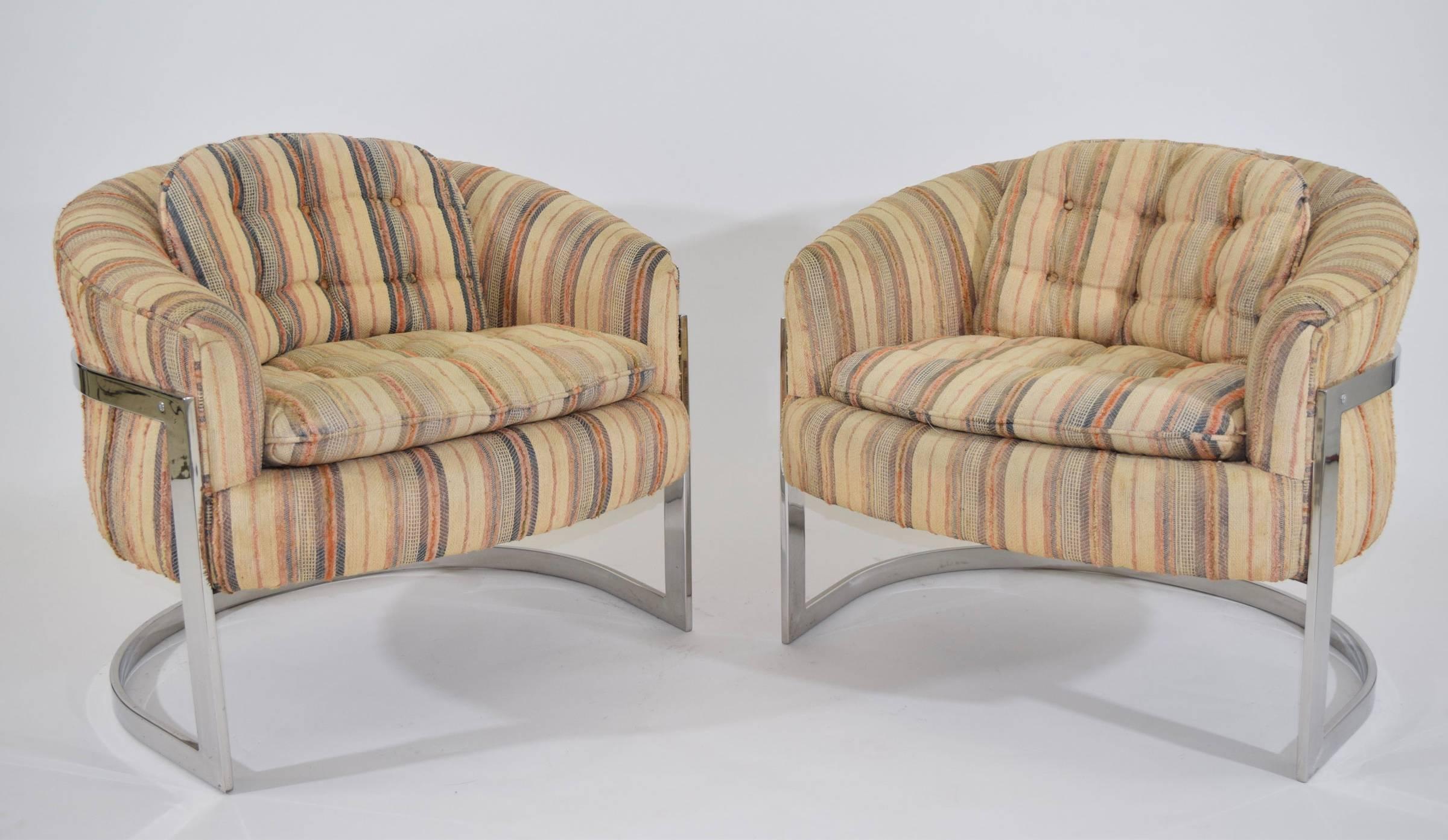 A really nice pair of Milo Baughman lounge chairs with a curved back and cantilevered chrome frame. We can help with reupholstery in fabric of buyers choice.