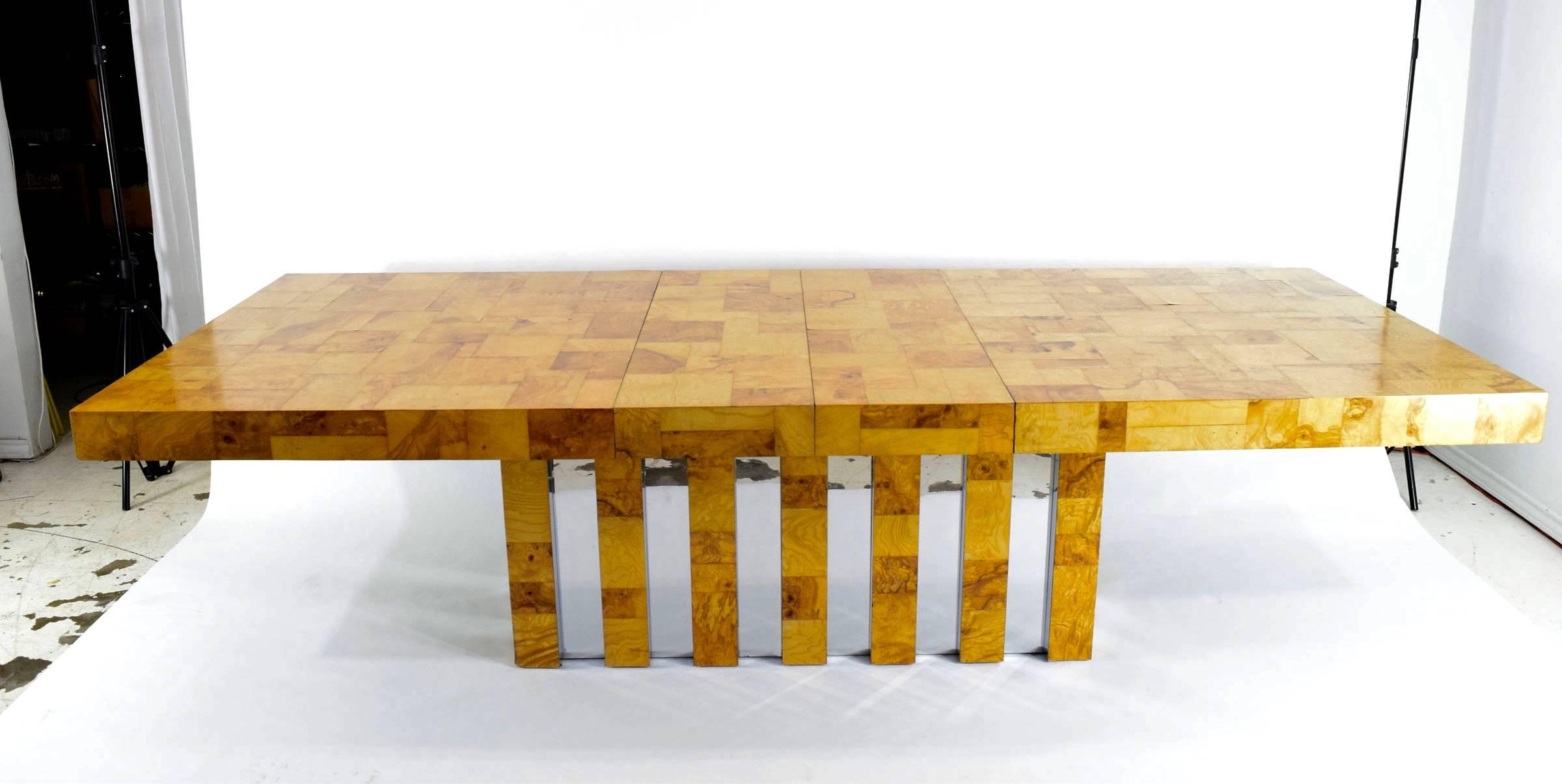 This is a beautiful table by Paul Evans for Directional. Beautiful patina burl wood in a mosaic pattern. Chrome trim on base. Table has two leaves that are 15