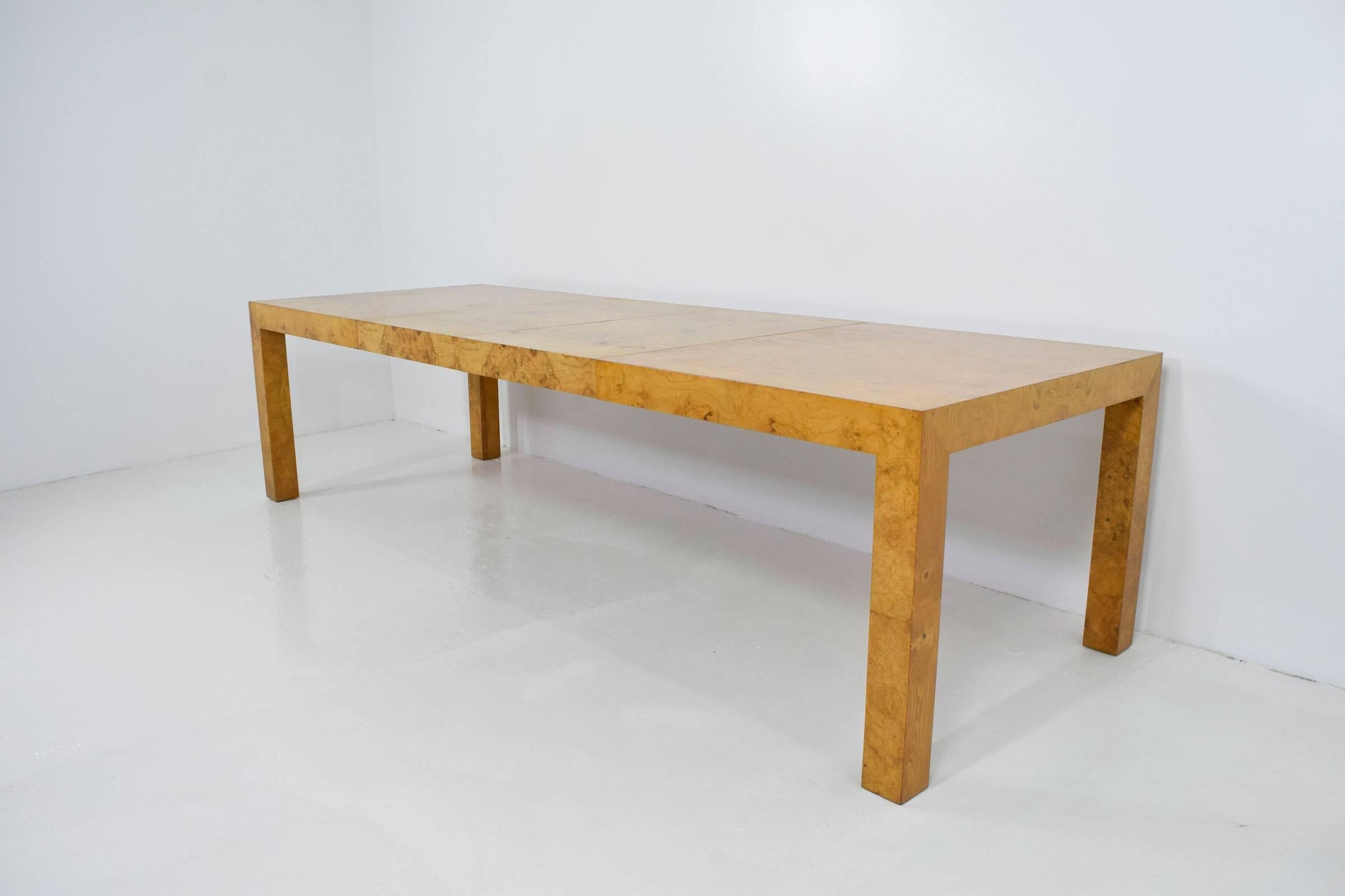 A beautiful Parsons style dining table by Milo Baughman for Thayer Coggin. Table includes two 22