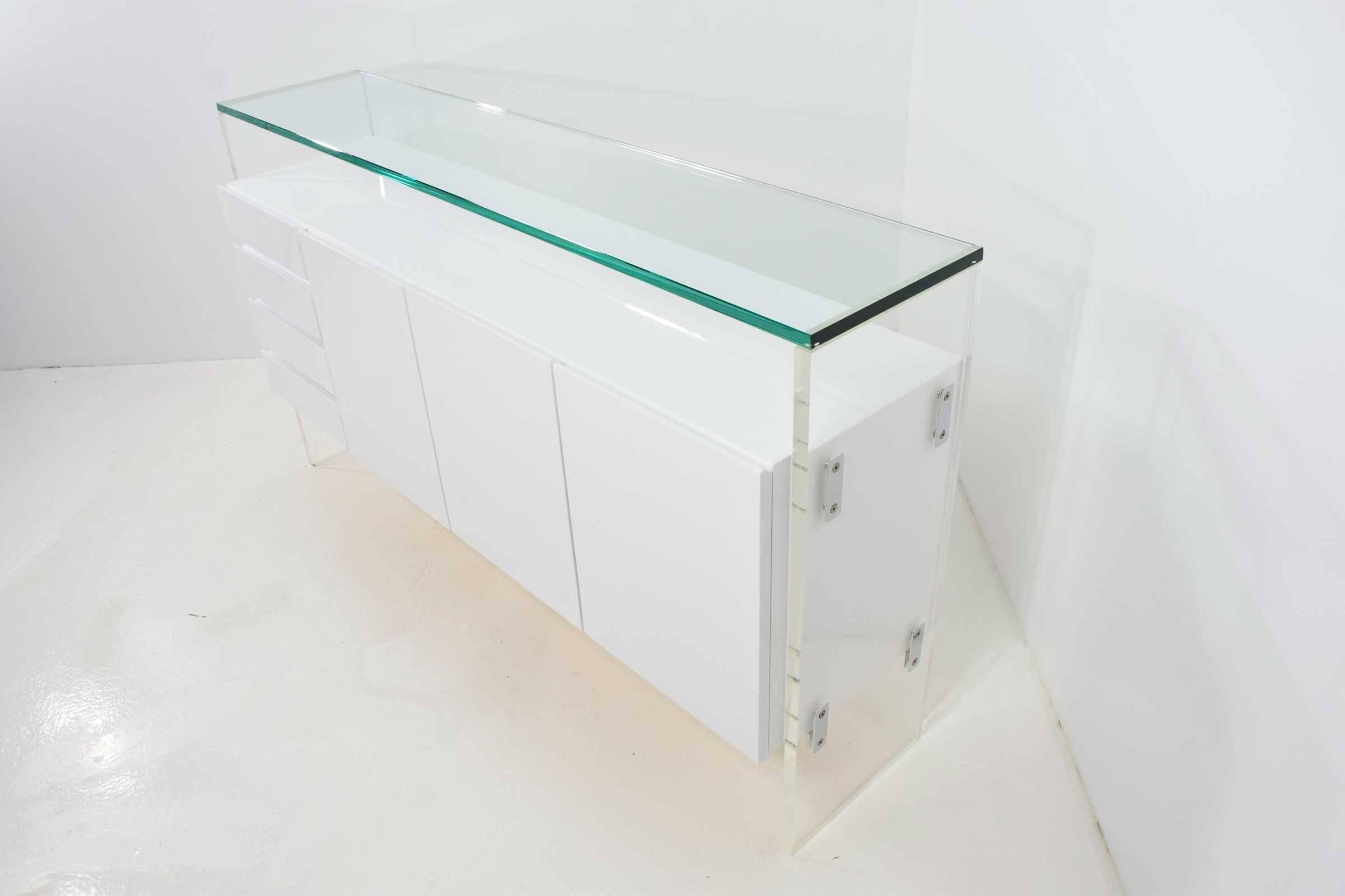 White lacquer, glass top, Lucite legs with chrome detail.